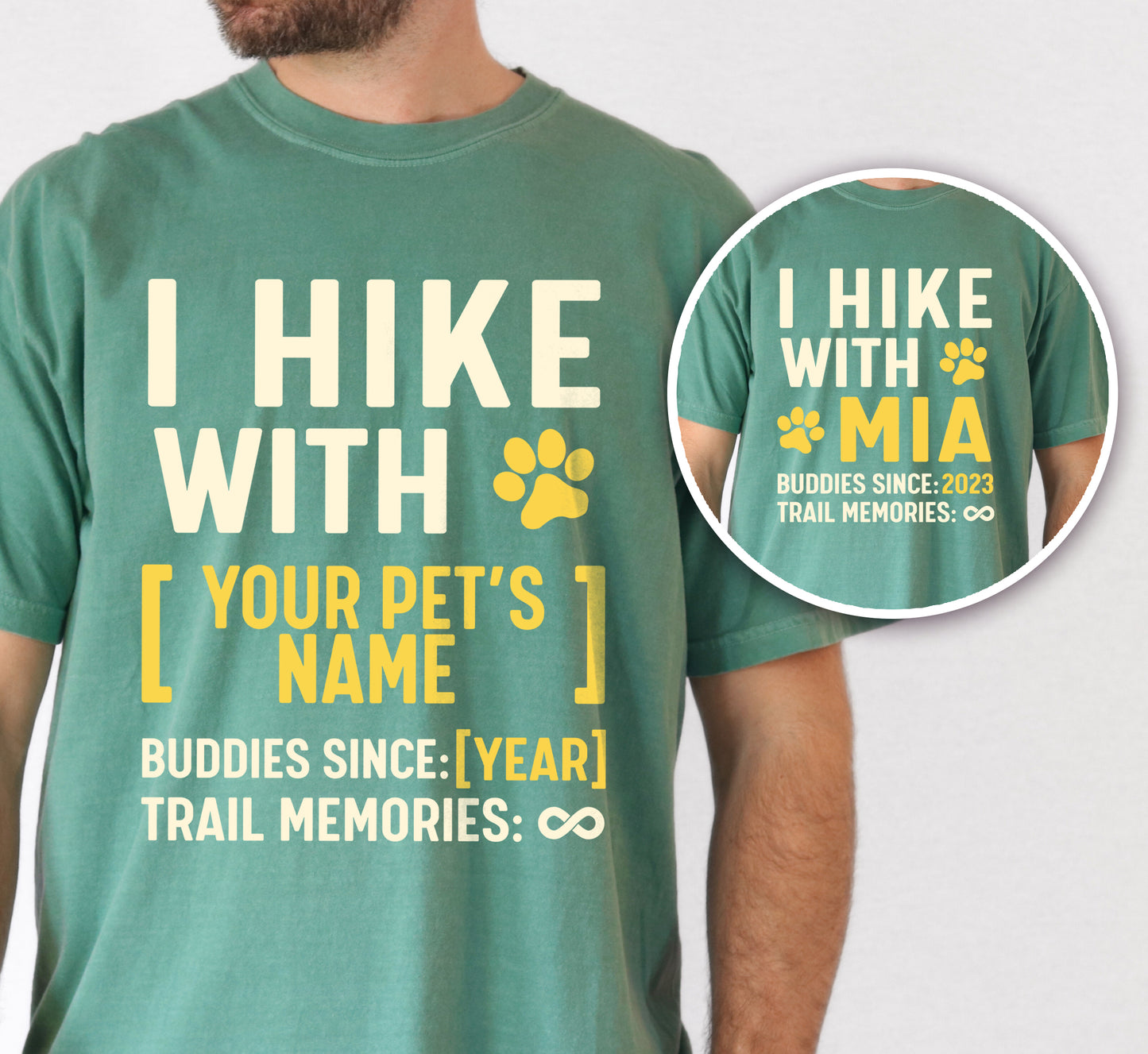 Light Green graphic t-shirt with 'Trail Buddies Personalized' design featuring 'I Hike with' text and customizable pet name field in cream and yellow lettering with paw prints, plus customizable year for 'buddies since' and trail memories infinity, shown with close-up detail.