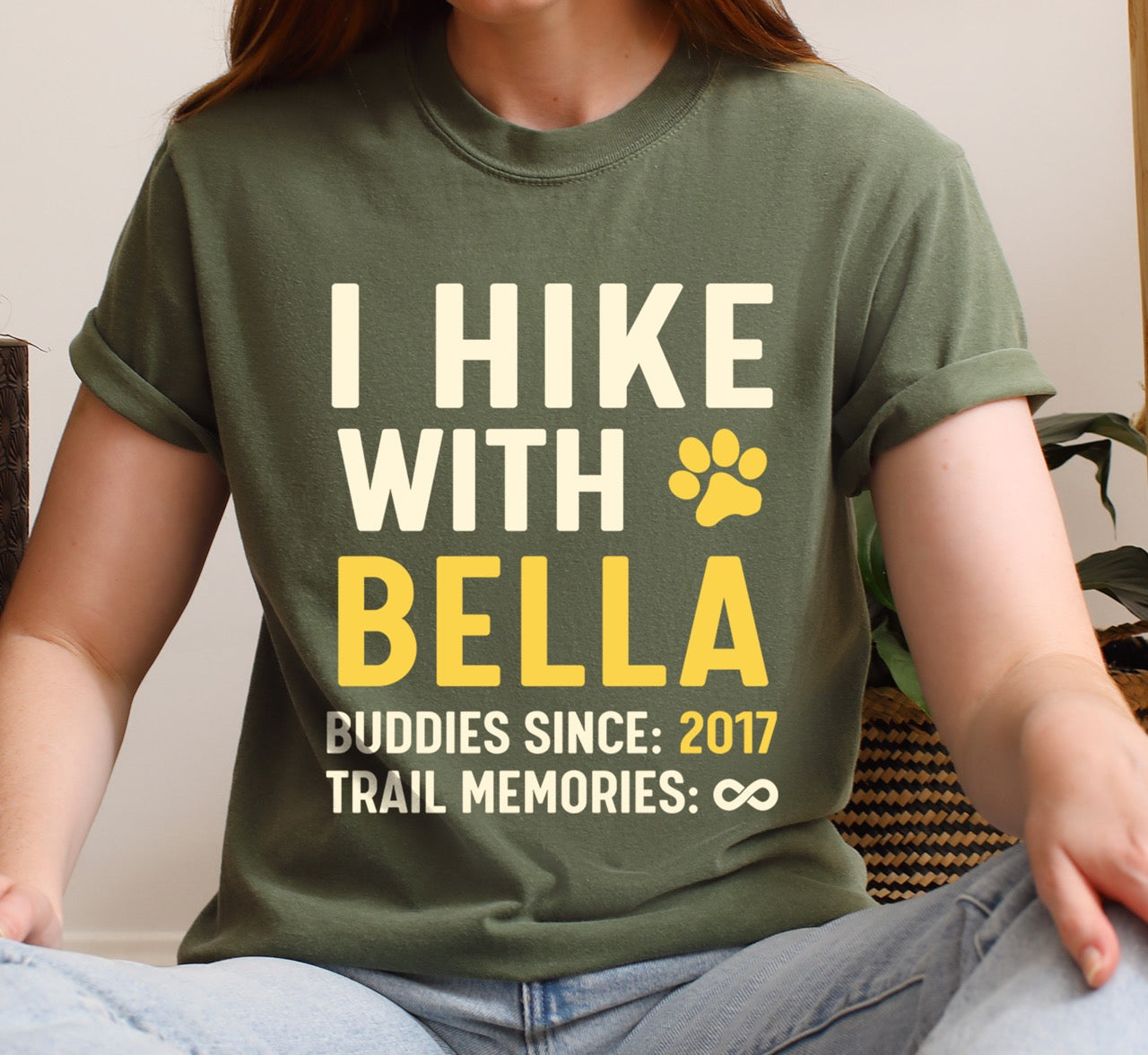 Woman wearing Personalized trail buddies shirt for dog hikers with custom pet name of Bella, paw print and buddies since year of 2017 featuring infinite memories design perfect gift for outdoor enthusiasts and their canine hiking partners