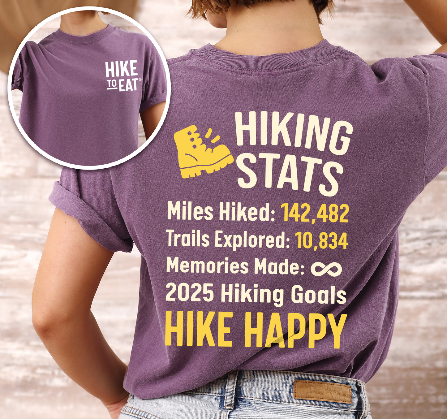 Berry (Dark Violet) Hike to Eat t-shirt front and back view showing small chest detail and large back design featuring 'Hiking Stats Personalized' with yellow hiking boot icon, customizable miles hiked and trails explored numbers, memories made infinity, and customizable 2025 hiking goals, displaying example stats and 'Hike Happy' goal.