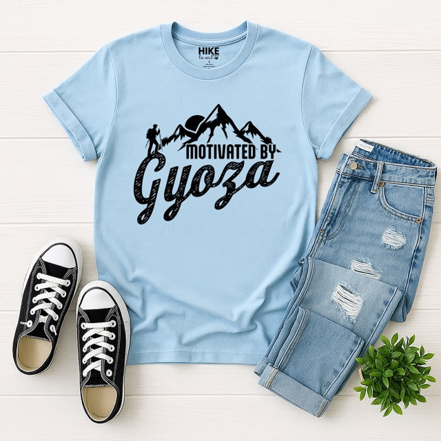 light blue Dark Chocolate (brown) Motivated by Gyoza statement tee with distressed typography, mountain peaks, and hiker silhouette for gyoza lovers and japanese food lovers with pants and shoes