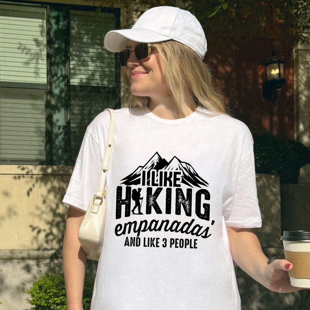 woman wearing white I like Hiking, Empanadas and like 3 People funny introvert statement tee with mountain peaks, hiker silhouette, and distressed typography for empanada-loving outdoor enthusiasts and hikers