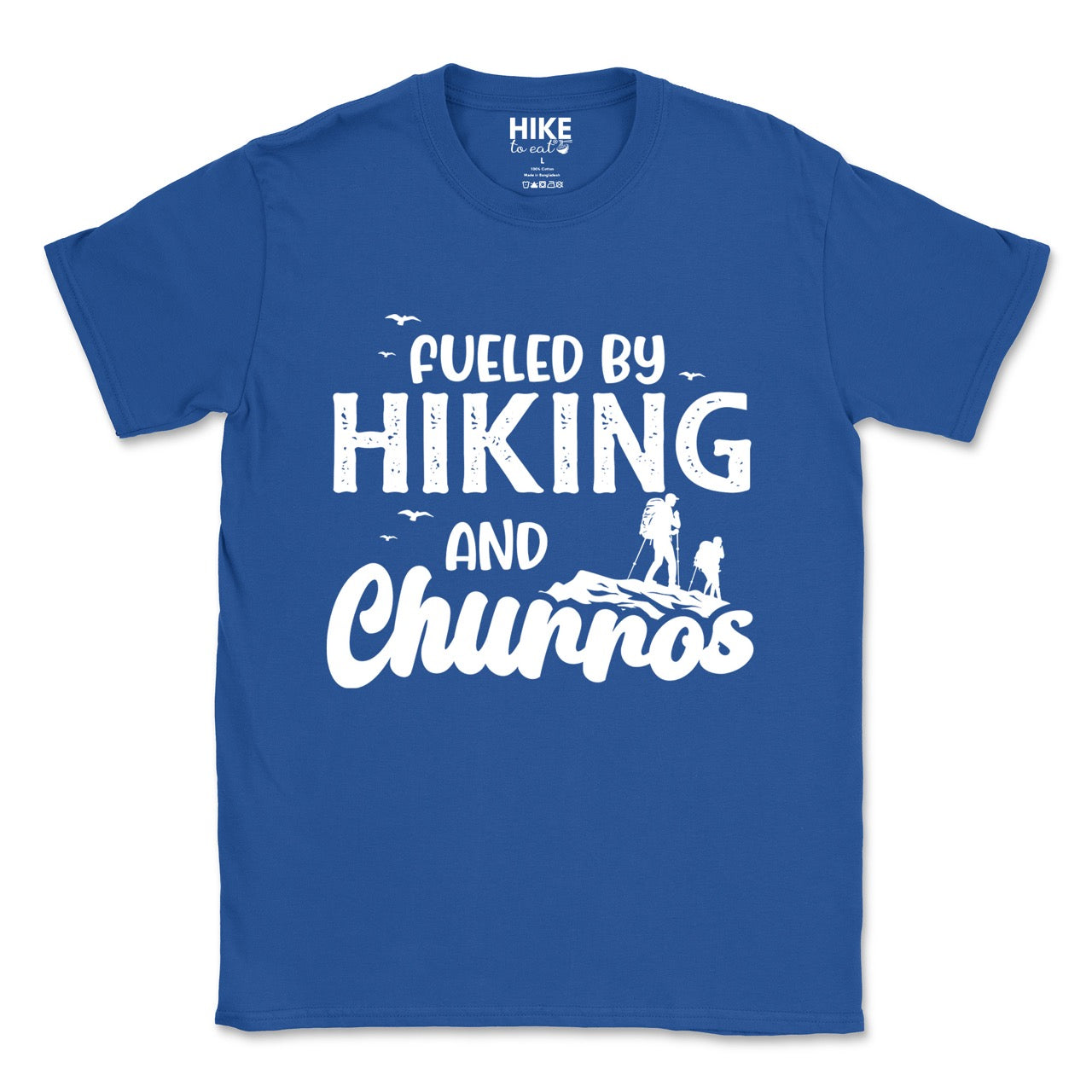 Royal blue Fueled by Hiking and Churros statement tee with bold distressed typography, flying birds, and two hiker silhouettes on mountain ridge for Spanish dessert-loving outdoor enthusiasts, hikers and foodies