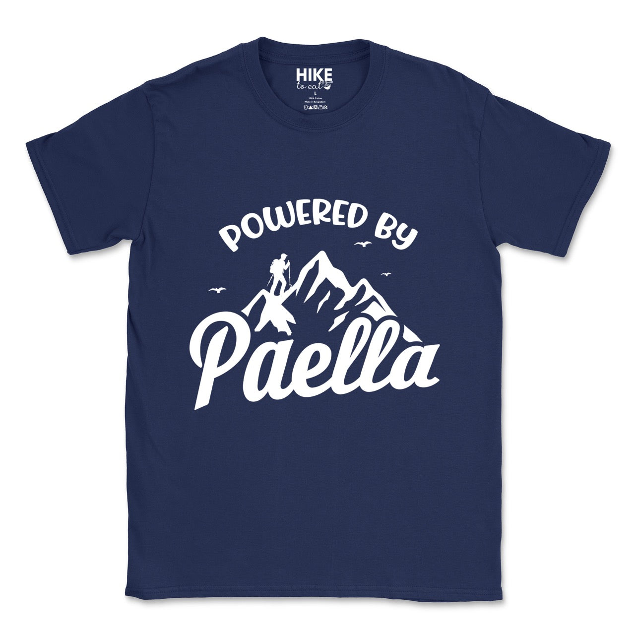 Navy Powered by Paella statement tee with bold curved typography, flowing script lettering, mountain peaks, hiker silhouette, and flying birds for Spanish food-loving outdoor enthusiasts, hikers and foodies
