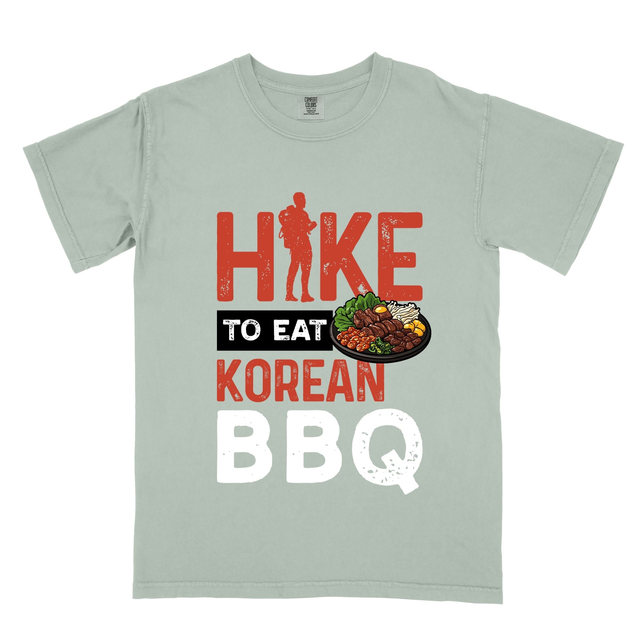 Bay "Hike to eat Korean bbq" colored vintage tee with bold typography, illustrated grilling platter korean bbq, mountains, birds, and backpacker for kbbq lovers.
