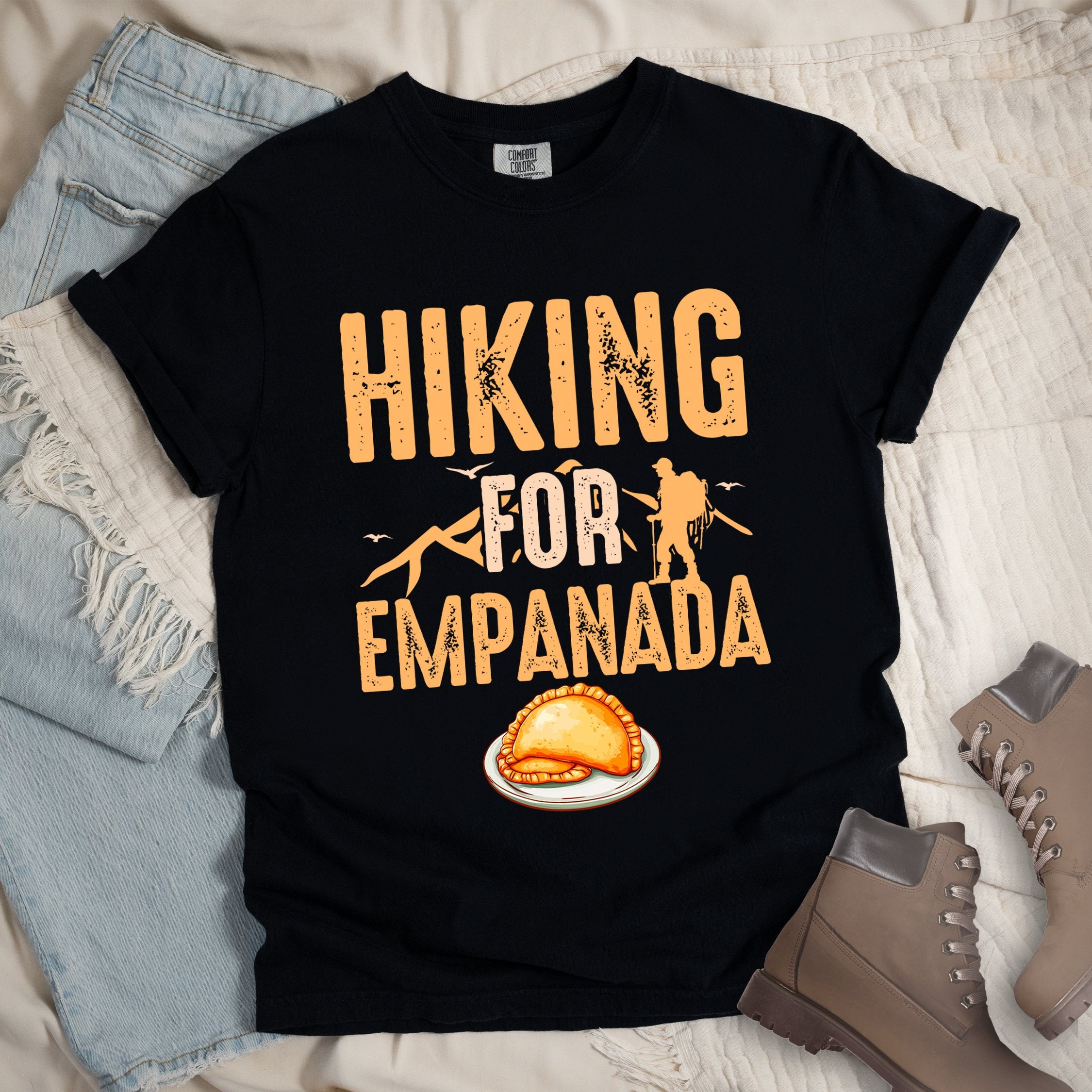 Black shirt with Hiking Design featuring the phrase “Hiking for Empanada” and a hiker silhouette with mountains and a plate of empanada.