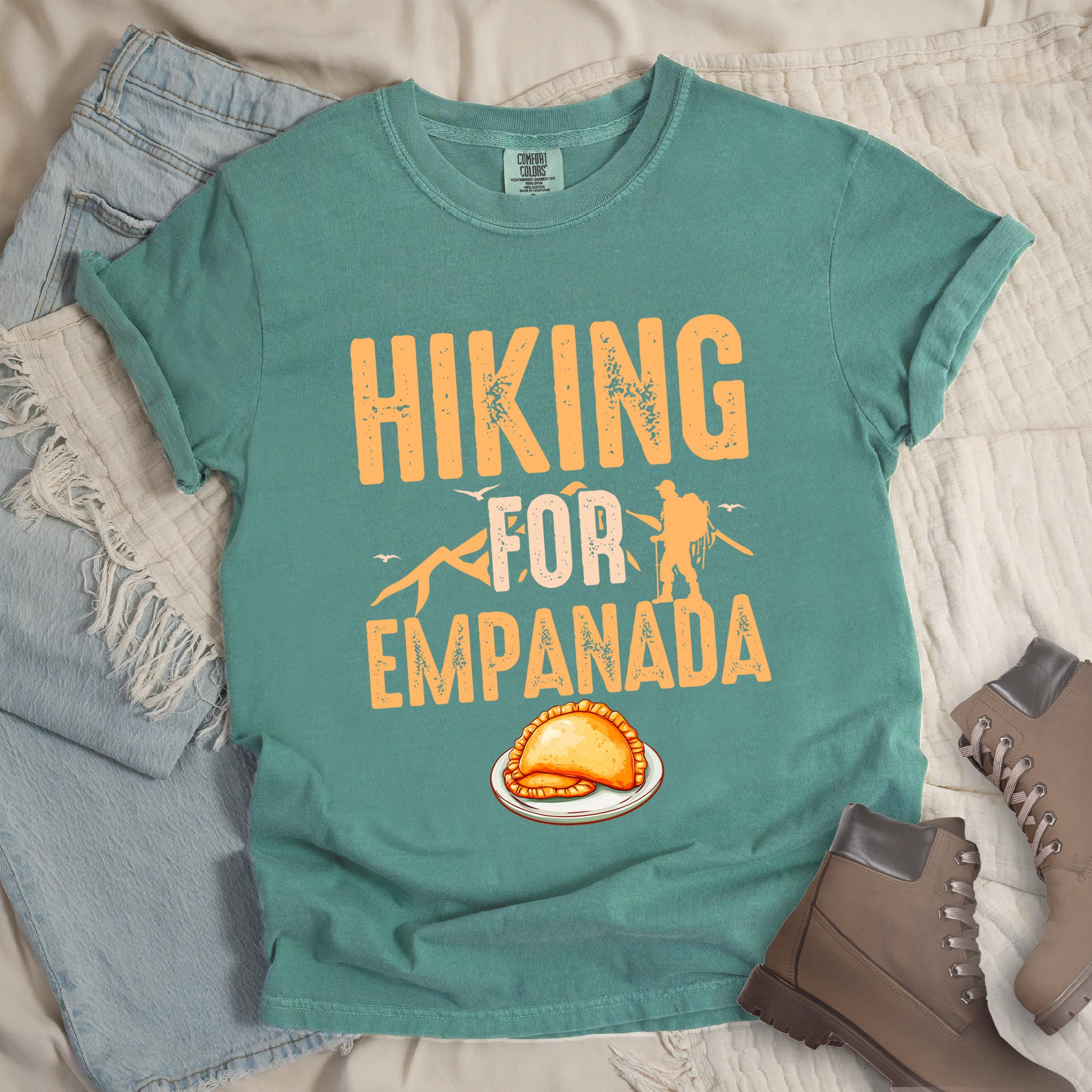 Green shirt with Hiking Design featuring the phrase “Hiking for Empanada” and a hiker silhouette with mountains and a plate of empanada.