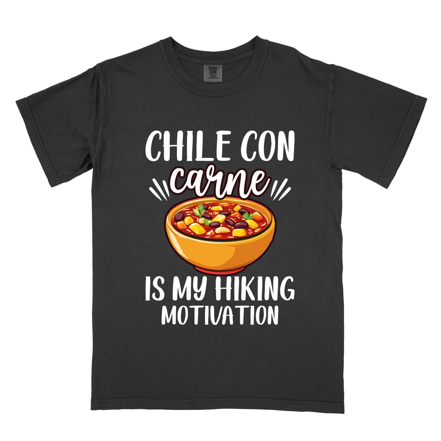 Black t-shirt with white text reading "CHILE CON carne IS MY HIKING MOTIVATION." The word "carne" appears in stylized script. In the center is a colorful illustration of a bowl of chili con carne showing beans, meat, corn, and vegetables in an orange bowl.