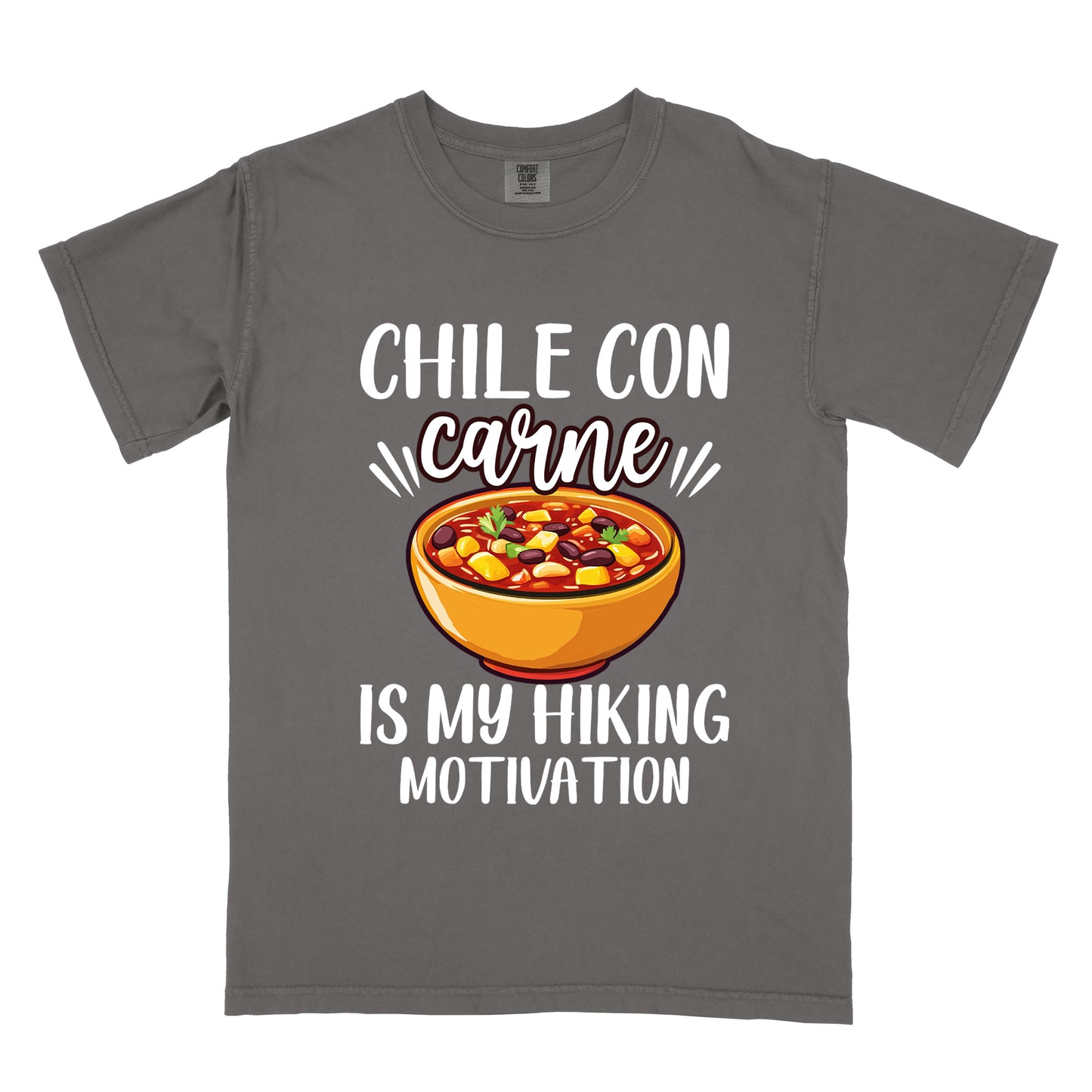 Pepper (Dark Gray) t-shirt with white text reading "CHILE CON carne IS MY HIKING MOTIVATION." The word "carne" appears in stylized script. In the center is a colorful illustration of a bowl of chili con carne showing beans, meat, corn, and vegetables in an orange bowl.