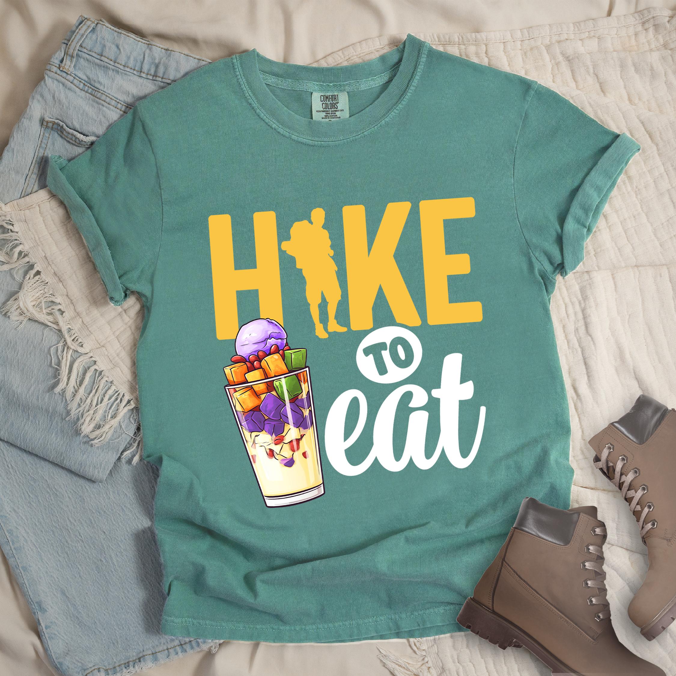 Green shirt with Hiking Design featuring the phrase “Hike to Eat” and an illustration of halo-halo dessert in a tall glass.