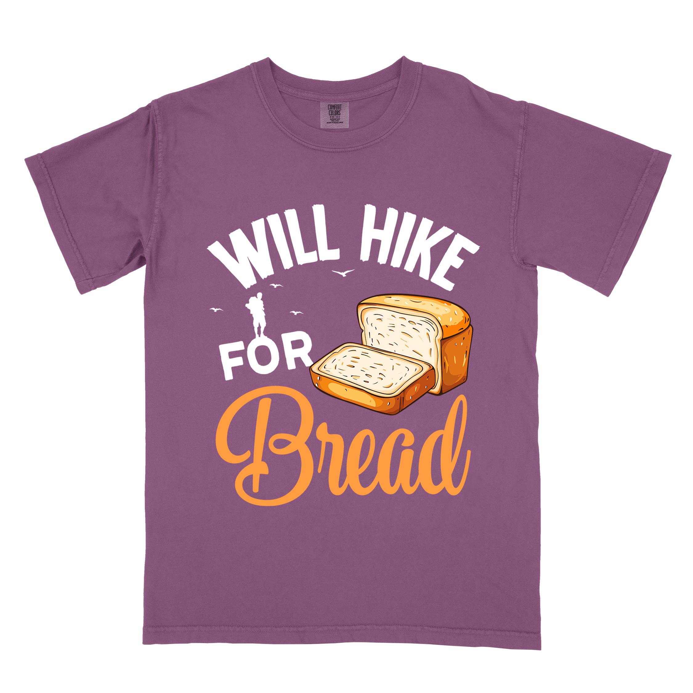 Berry "Will hike for bread" colored statement tee with flowing script typography, bold lettering, and loaf of bread illustration for pastry-loving outdoor enthusiasts, hikers and foodies