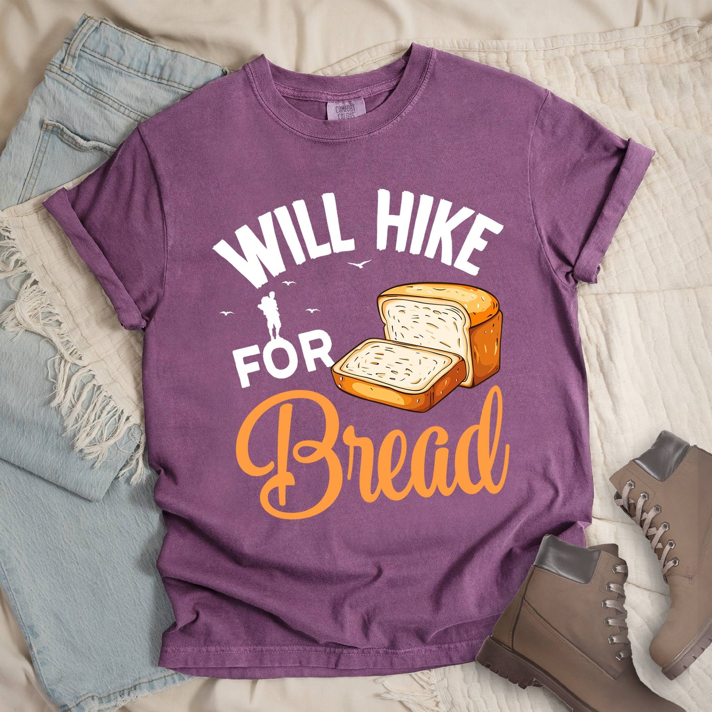 Dark pink shirt with Hiking Design featuring the phrase “Will Hike for Bread” and an illustration of sliced bread loaves.