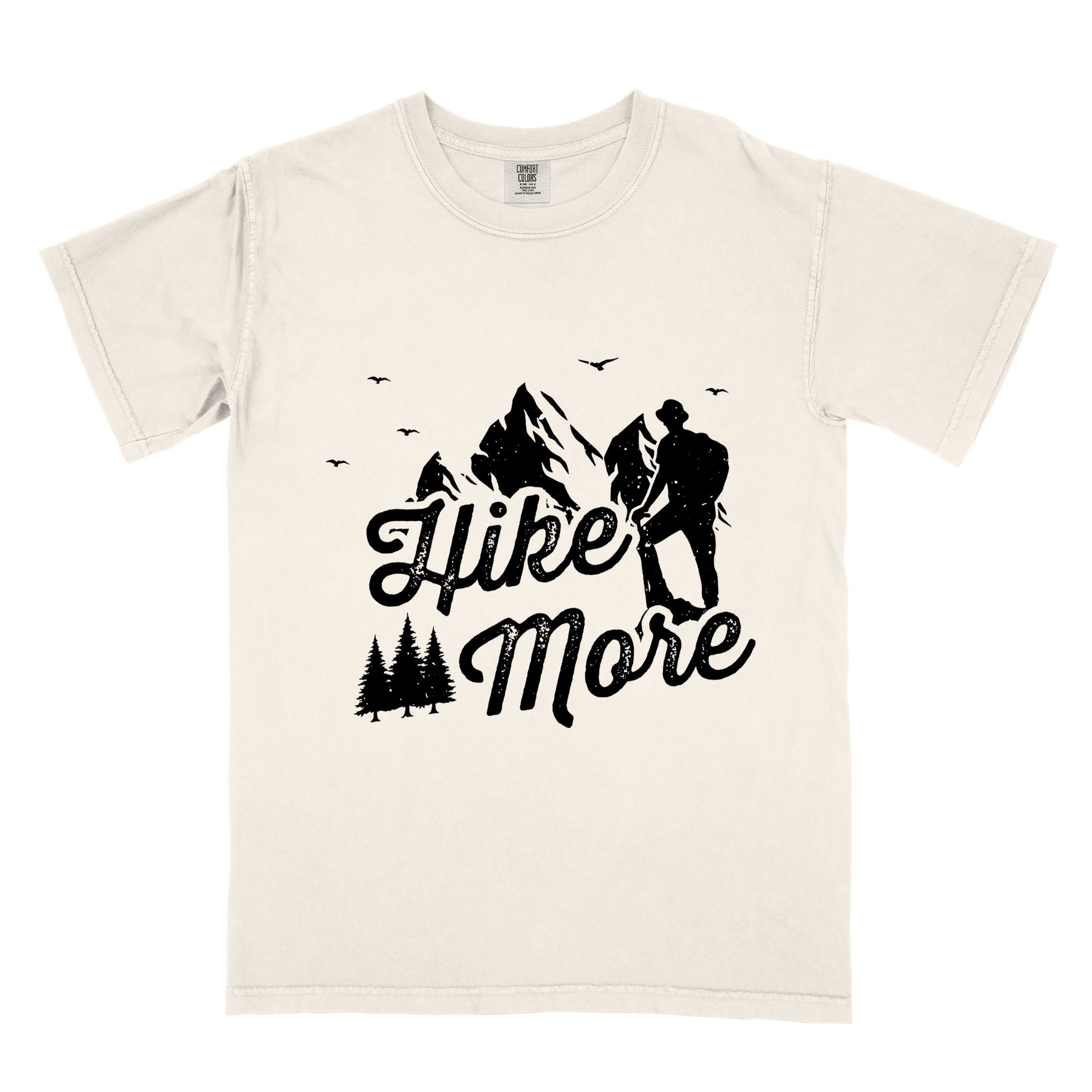 Ivory "Hike More" colored statement tee with bold typography, mountains, birds, perfect for food motivated individuals.