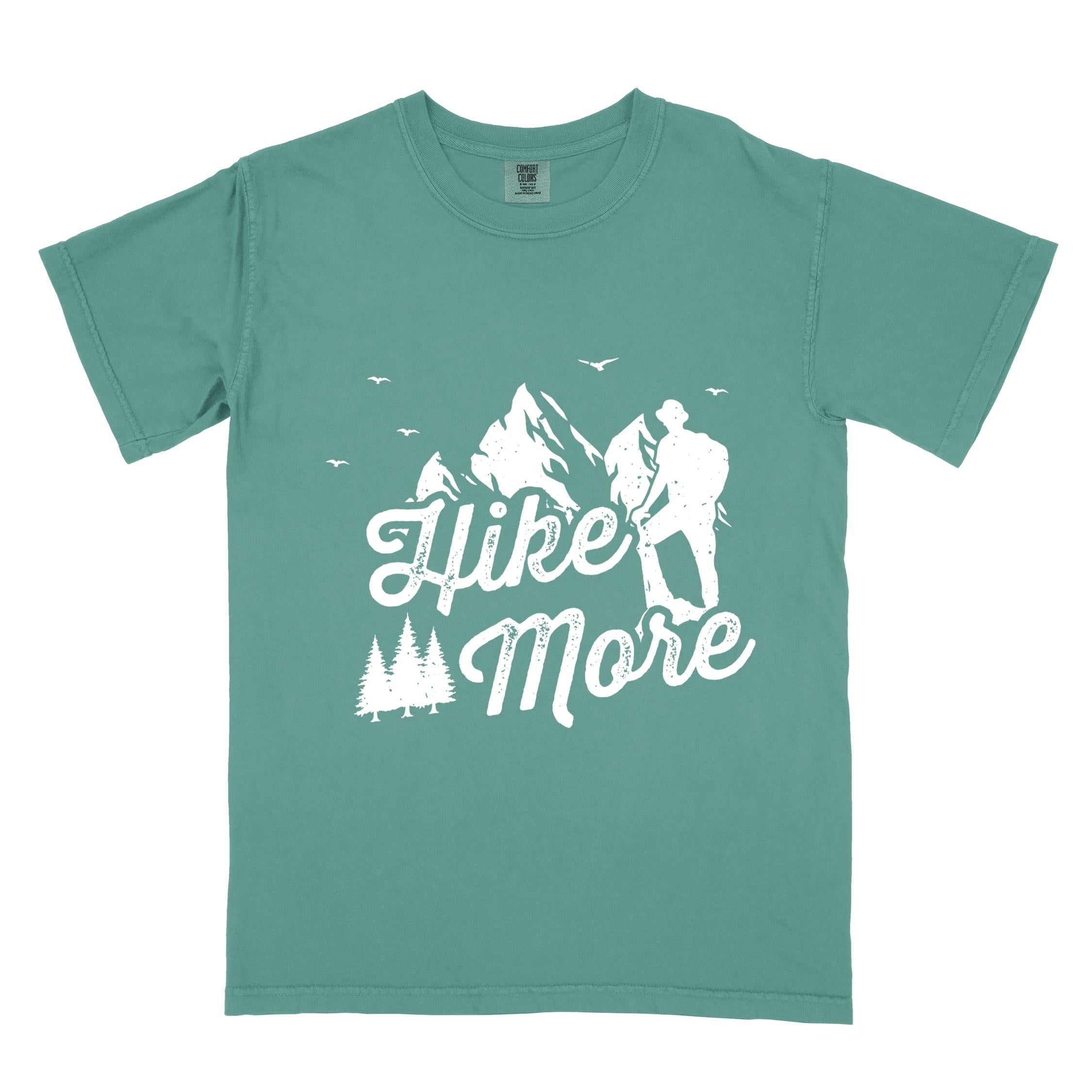Light green "Hike More" colored statement tee with bold typography, mountains, birds, perfect for food motivated individuals.