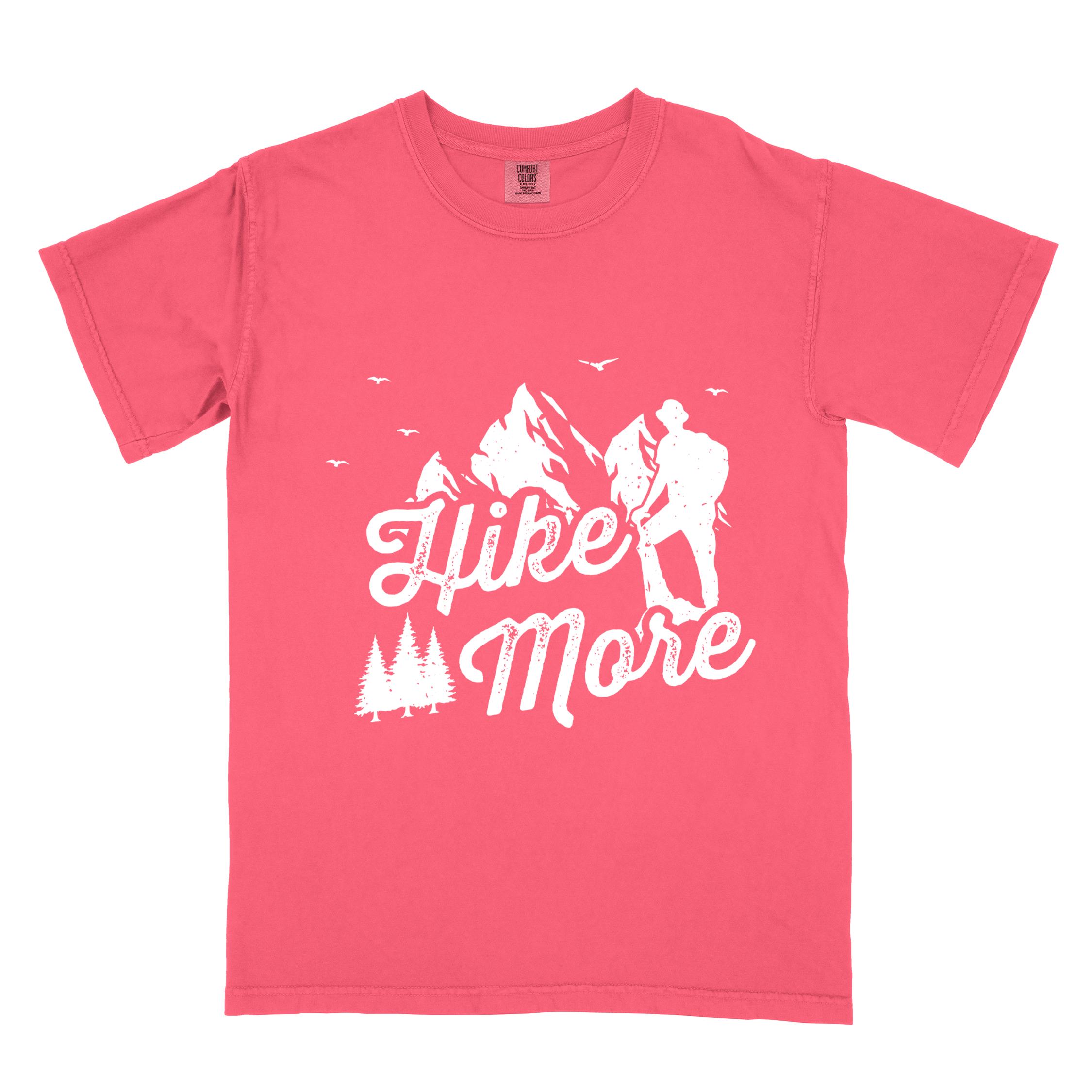 Watermelon "Hike More" colored statement tee with bold typography, mountains, birds, perfect for food motivated individuals.