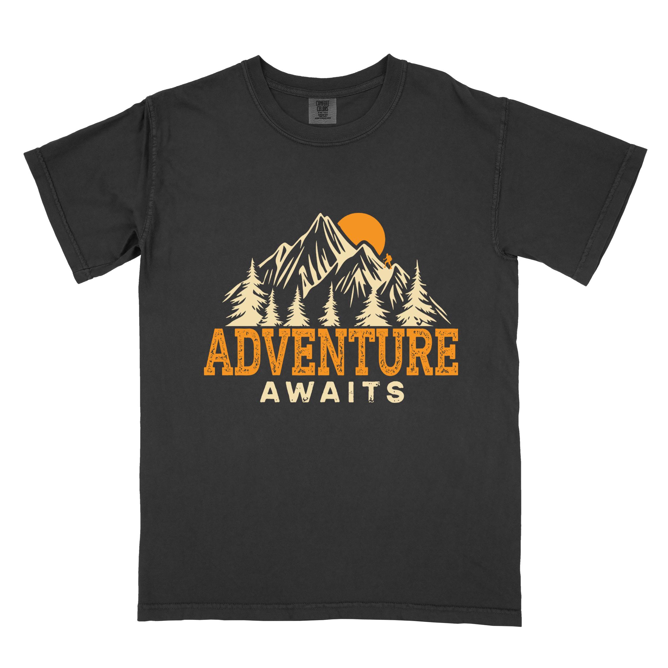 Black "Adventure Awaits" colored statement tee with bold typography, mountains, birds, perfect for adventure motivated individuals.
