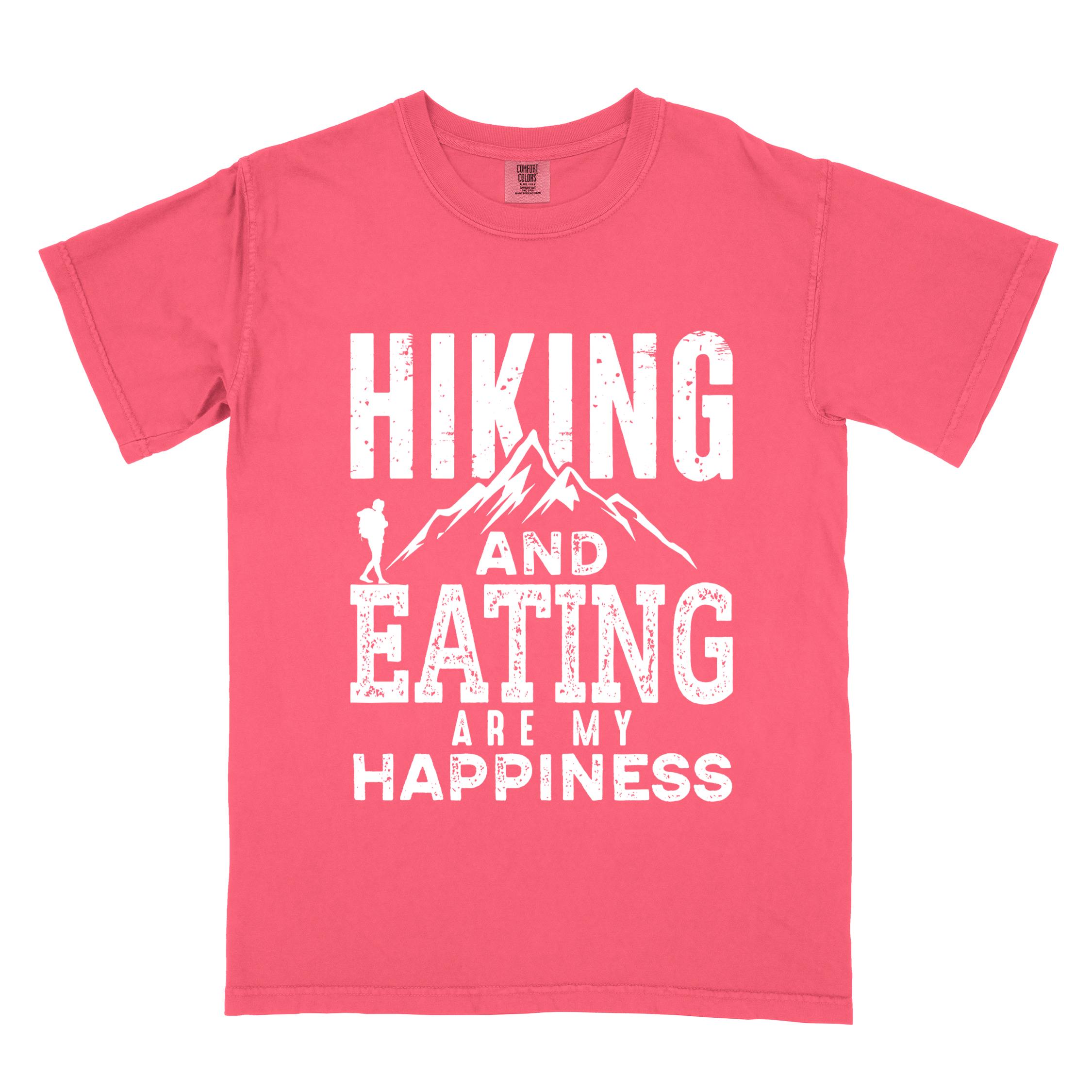 Watermelon "Hiking and Eating are my happiness" colored statement tee with bold typography, mountains, birds, perfect for adventure motivated individuals.