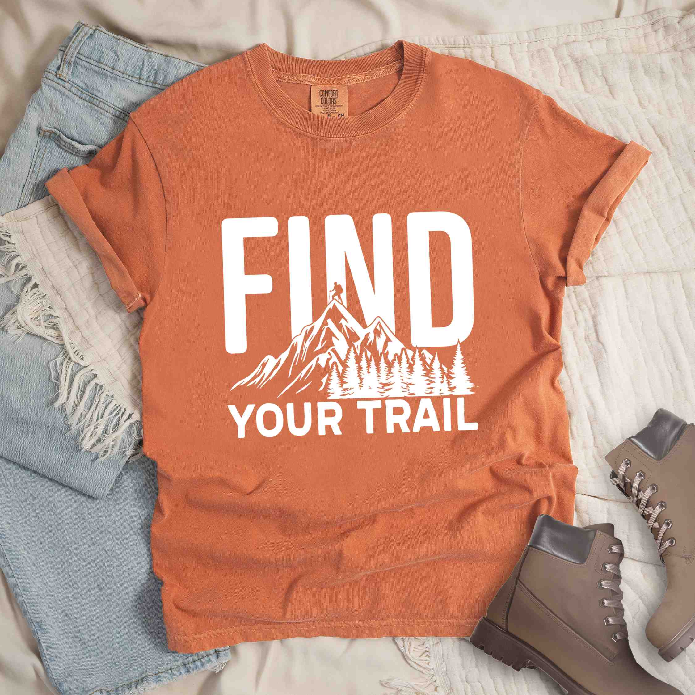 Yam "Find your trail" colored statement tee with bold typography, mountains, birds, perfect for adventure motivated individuals.