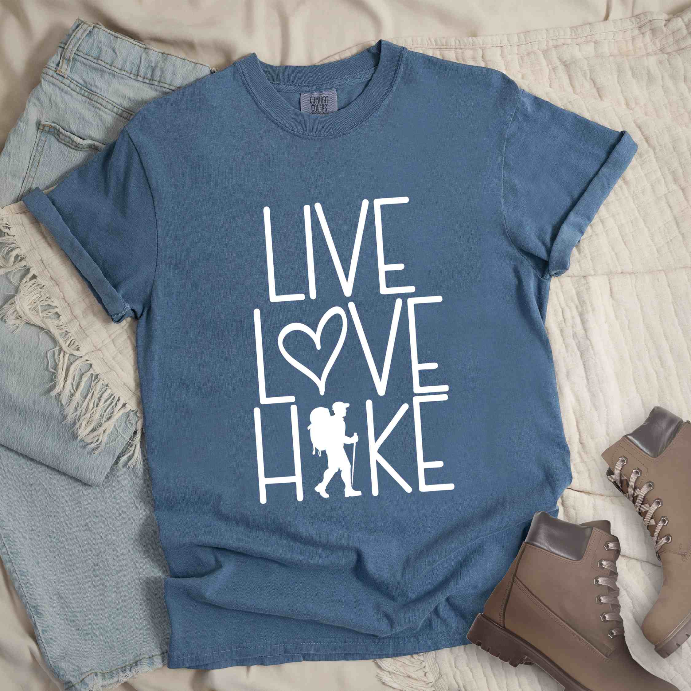Blue jean "Live Love hike" colored statement tee with bold typography, perfect for adventure motivated individuals.