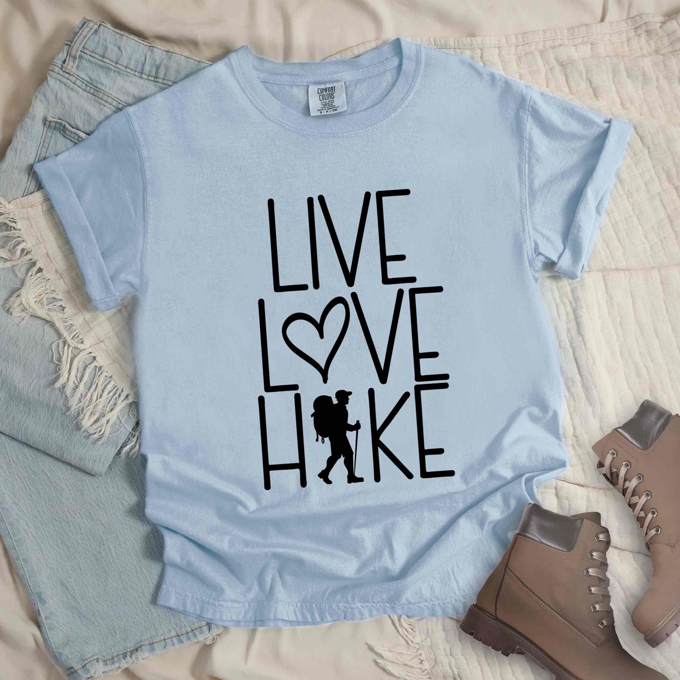 Chambray "Live Love hike" colored statement tee with bold typography, perfect for adventure motivated individuals.