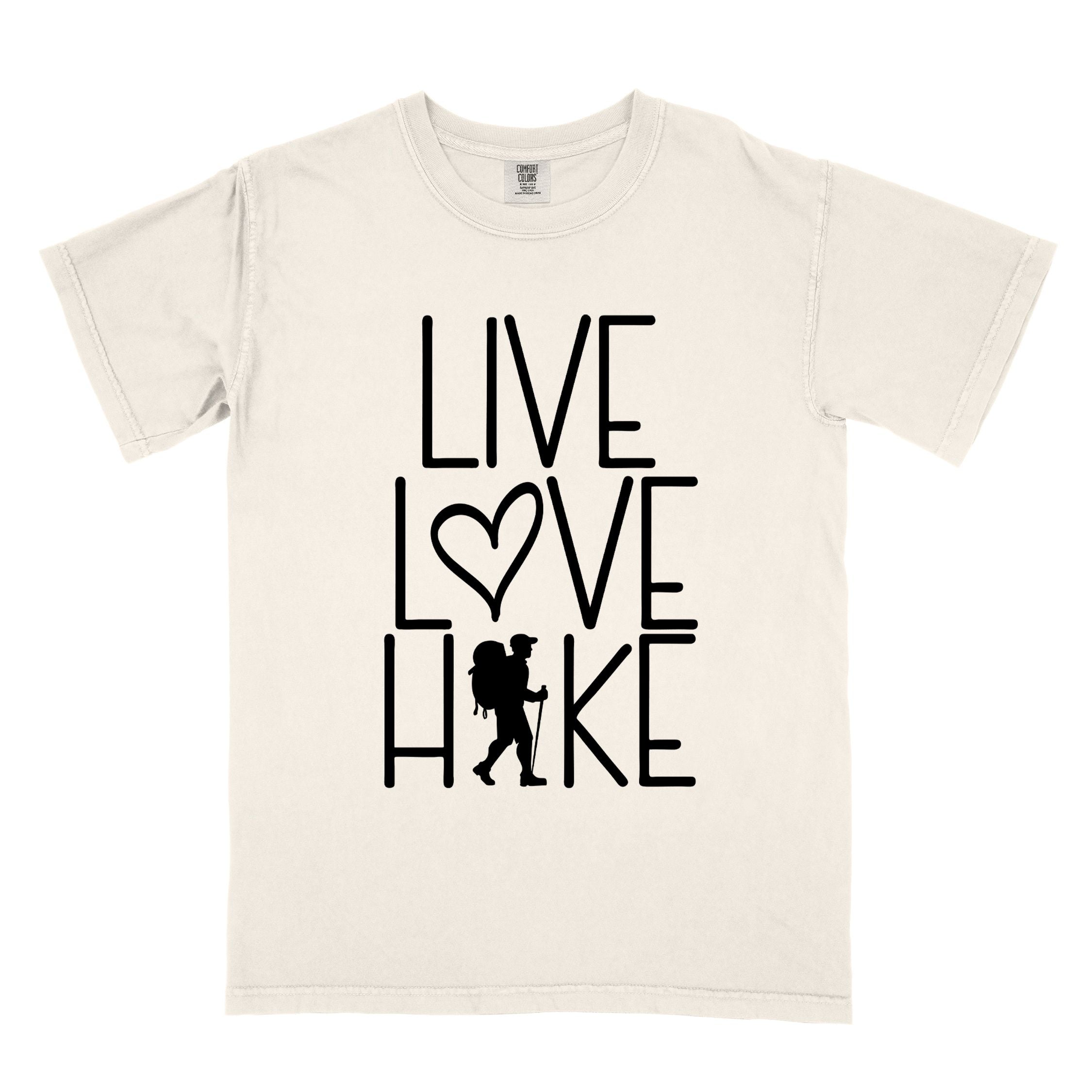Ivory "Live Love hike" colored statement tee with bold typography, perfect for adventure motivated individuals.