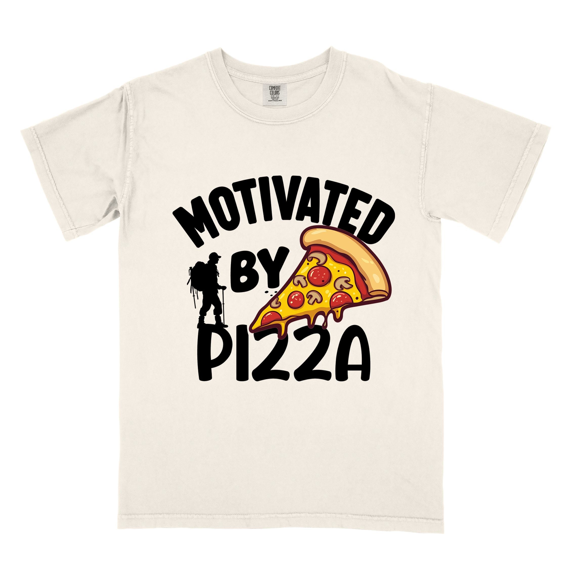 Ivory Motivated by Pizza colored vintage tee with bold typography, illustrated pizza slice, and backpacker for foodies.