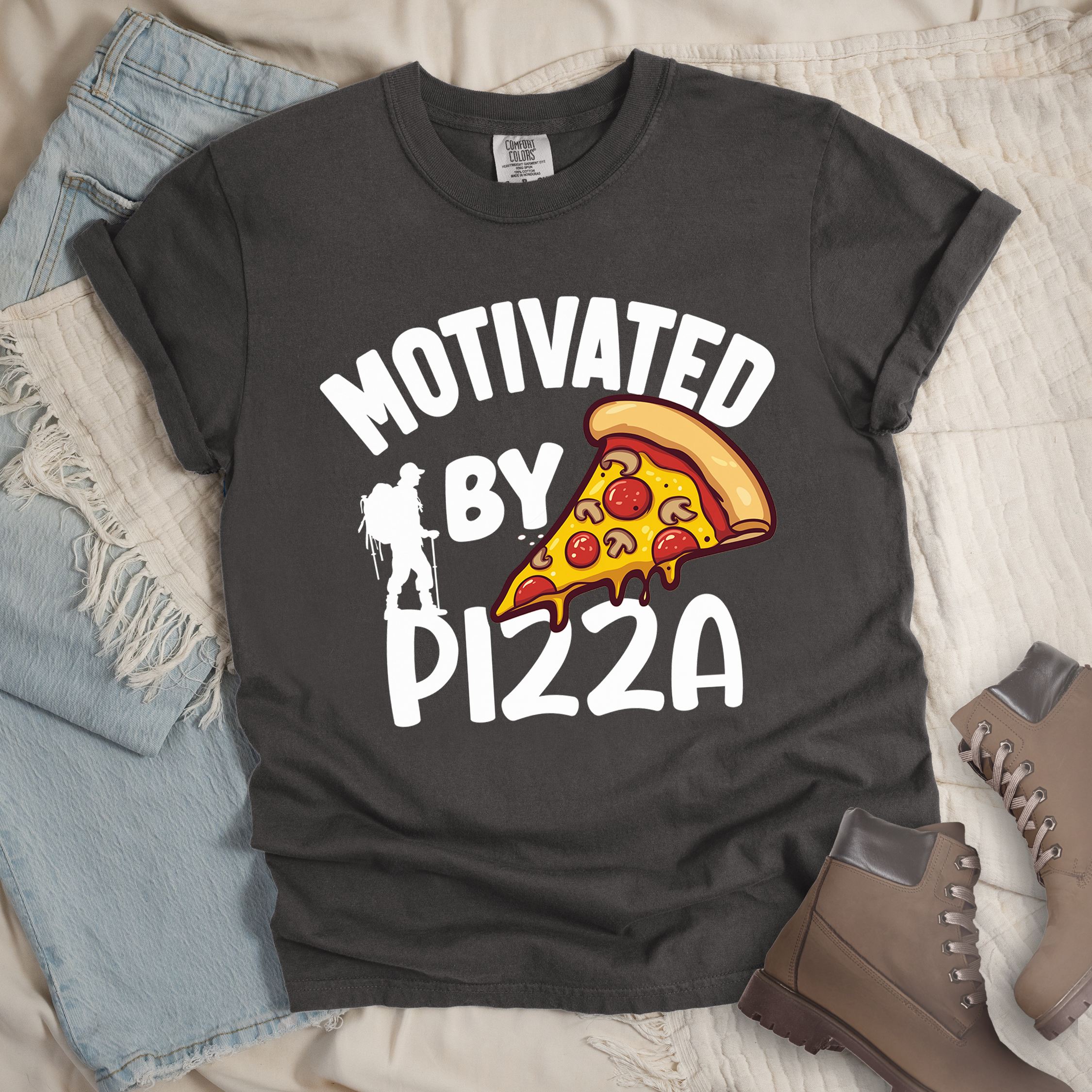 Dark grey shirt showing a hiking design with 'Motivated By Pizza' phrase and an illustration of a slice of pizza