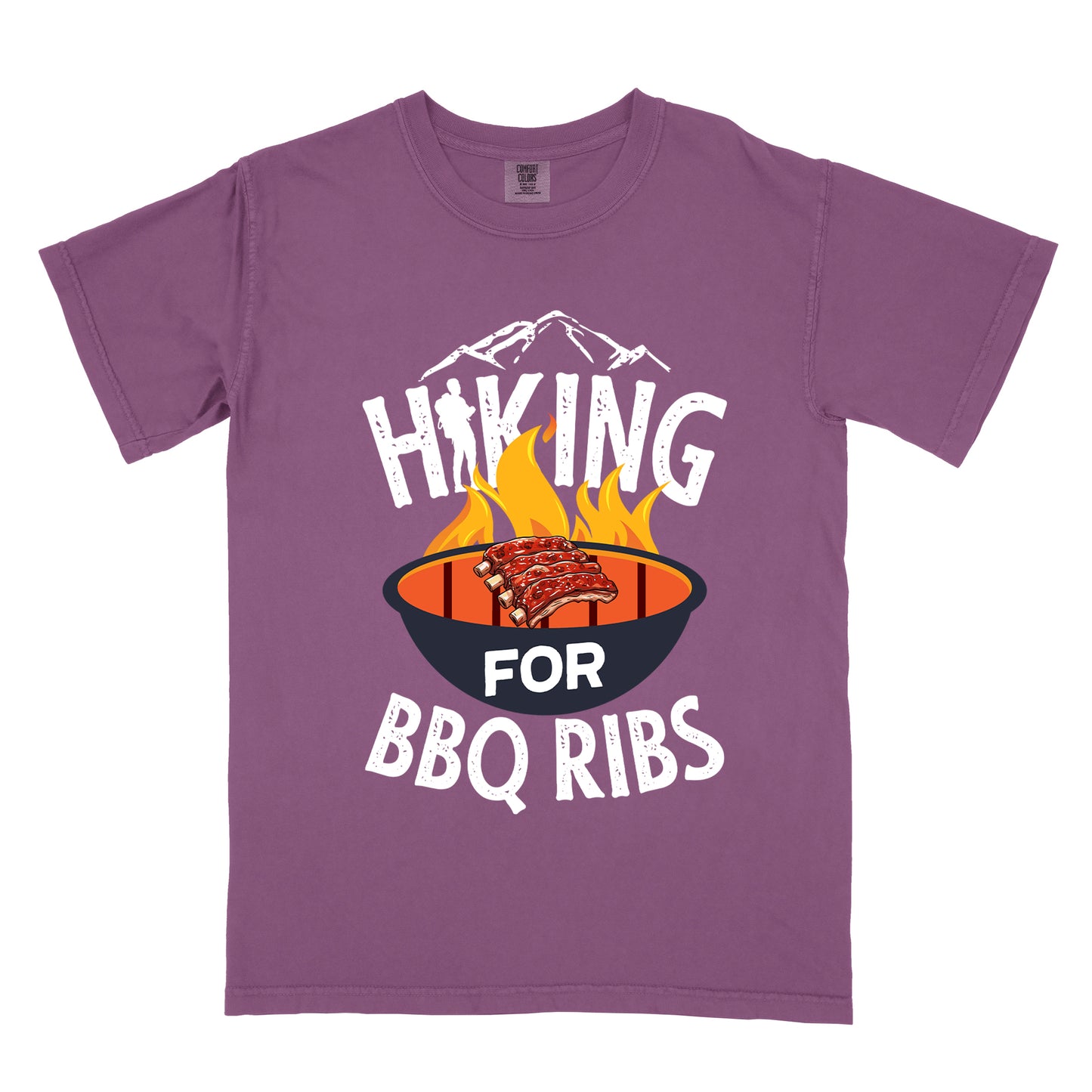Berry (Dark Violet) t-shirt with white distressed text reading "HIKING FOR BBQ RIBS". Mountain silhouettes appear above the word "HIKING". The letter "I" in "HIKING" features a hiker silhouette. Between "HIKING" and "BBQ RIBS" is an illustration of a grill with flames and a rack of ribs cooking. The word "FOR" appears in white on the grill.