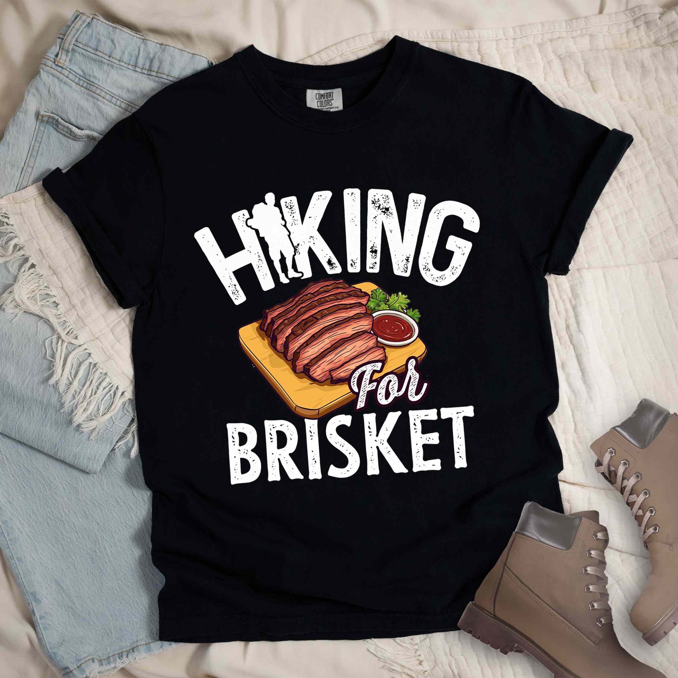 Black Hiking for brisket colored vintage tee with bold typography, illustrated sliced brisket, birds, and backpacker for brisket lovers