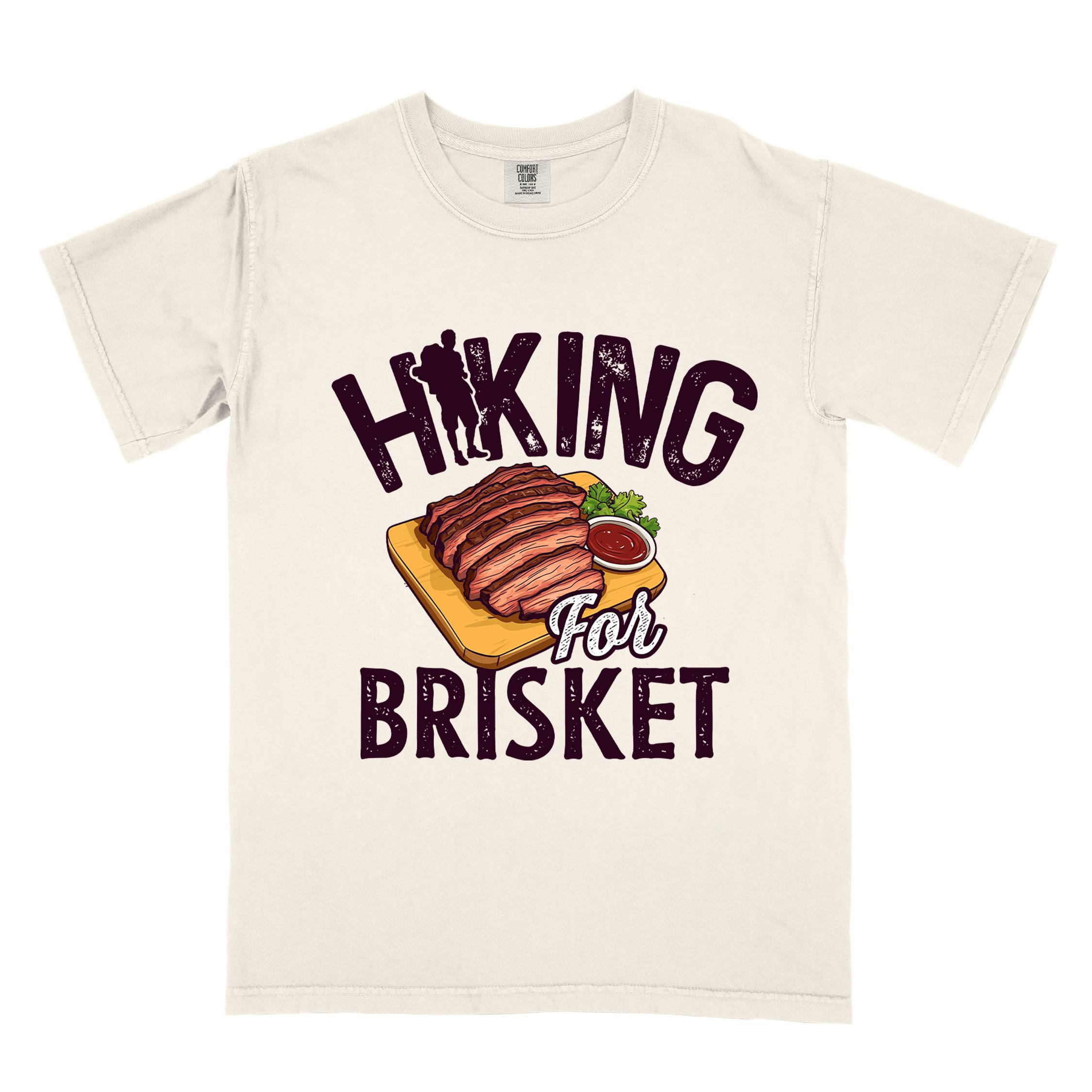 Ivory Hiking for brisket colored vintage tee with bold typography, illustrated sliced brisket, birds, and backpacker for brisket lovers