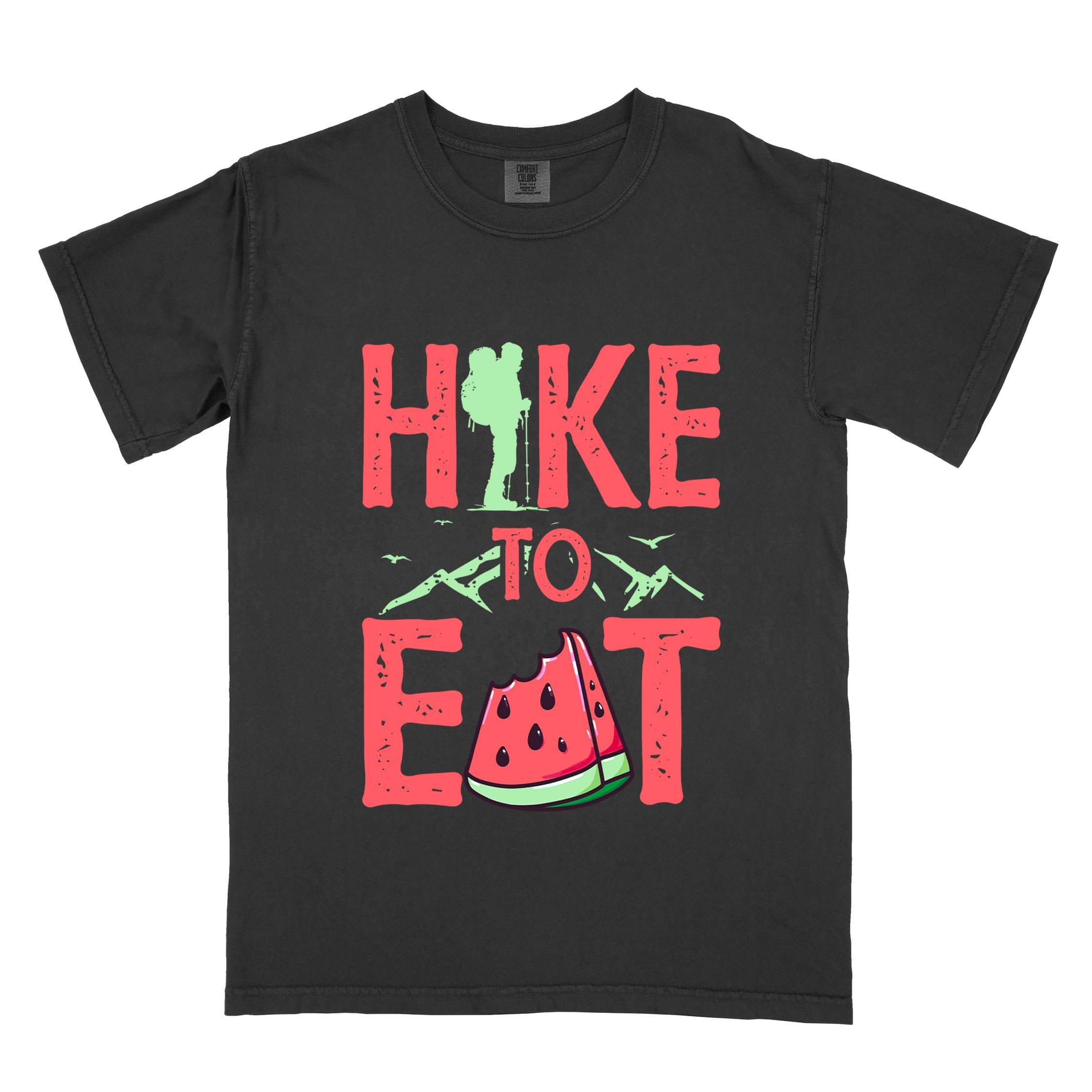 Black "Hike to Eat" colored statement tee with bold typography, mountain, illustrated slice of watermelon, perfect for fruit lovers.