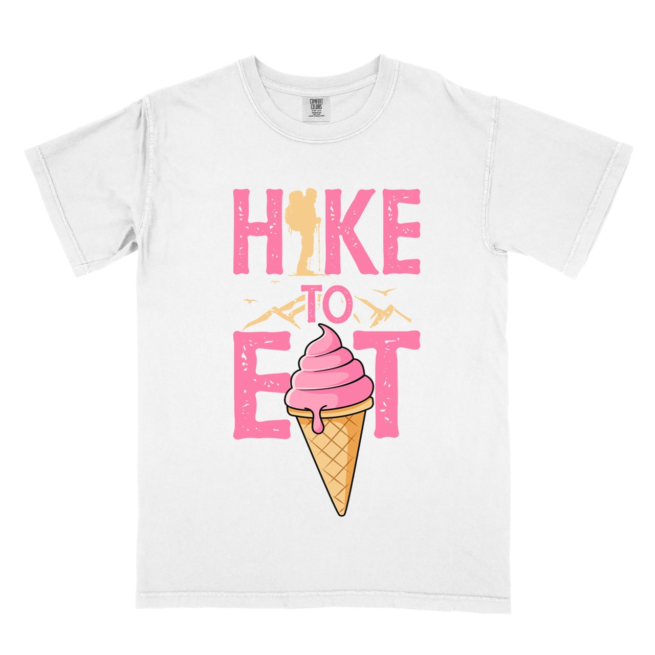 White Hike to Eat brand logo t-shirt with distressed pink typography, hiker silhouette integrated into letters, mountain peaks, flying birds, and soft-serve ice cream cone illustration for dessert-loving outdoor enthusiasts