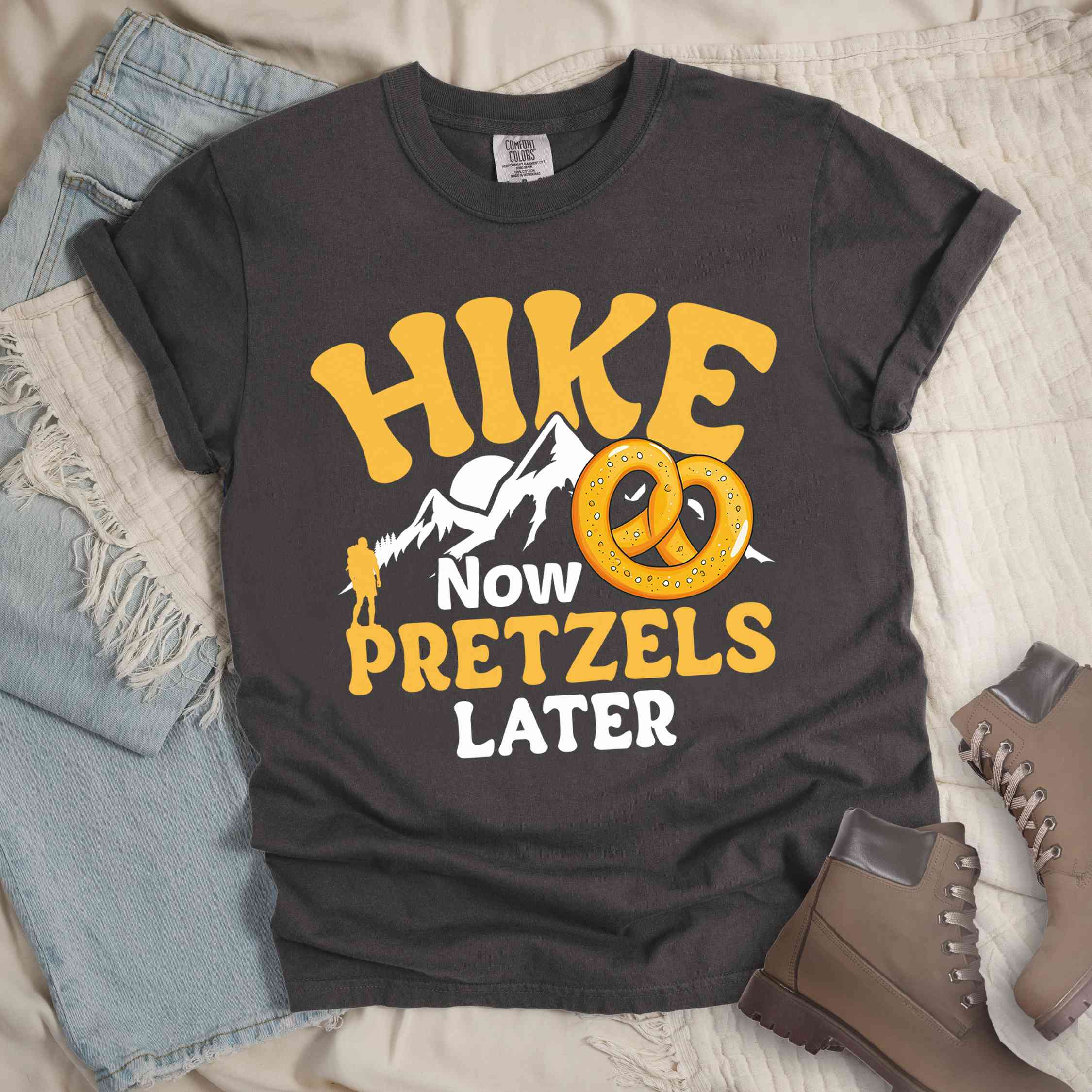 Pepper Hike now Pretzels later colored vintage tee with bold typography, , mountains, sunrise, and illustrated pretzel for baked pretzel lovers