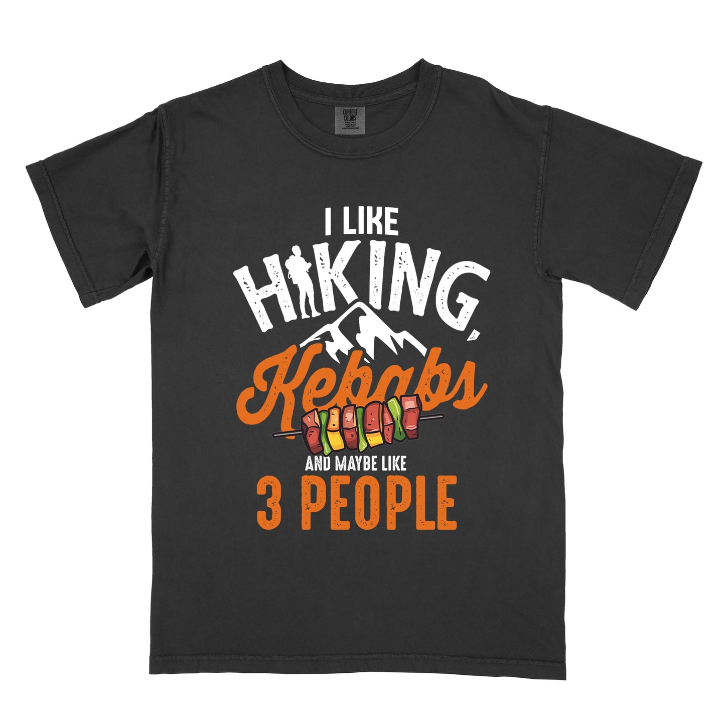 Black t-shirt with white text "I LIKE HIKING," with the letter "I" in "HIKING" replaced by a hiker silhouette. Below that is "Kebabs" in orange script with an illustration of a kebab skewer. Small white mountain silhouettes appear between these elements. At the bottom in white and orange text is "AND MAYBE LIKE 3 PEOPLE". The design combines hiking imagery with food and a humorous introvert sentiment.