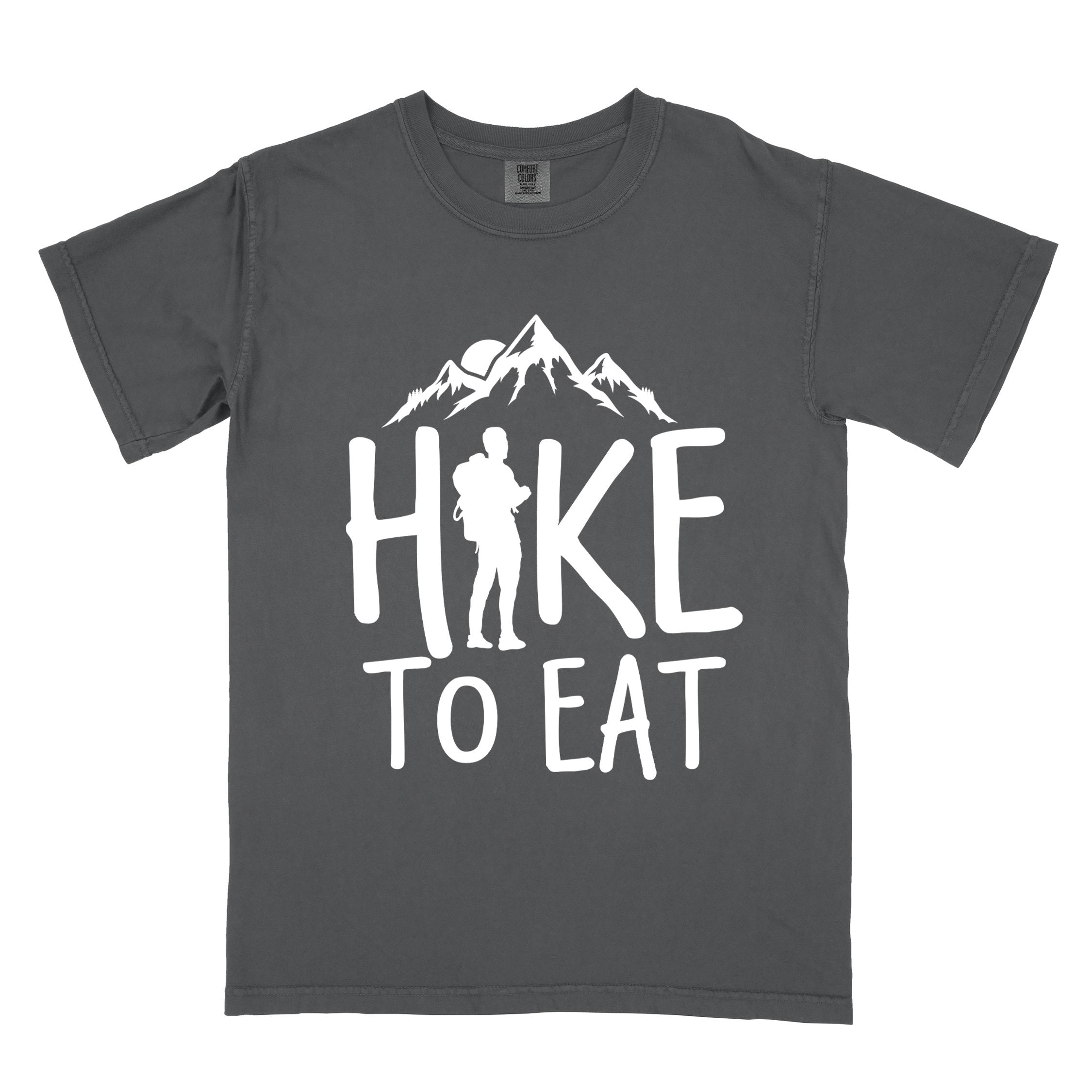 Graphite "Hike to Eat" colored statement tee with bold typography, mountains, birds, sunrise, perfect for food motivated individuals.