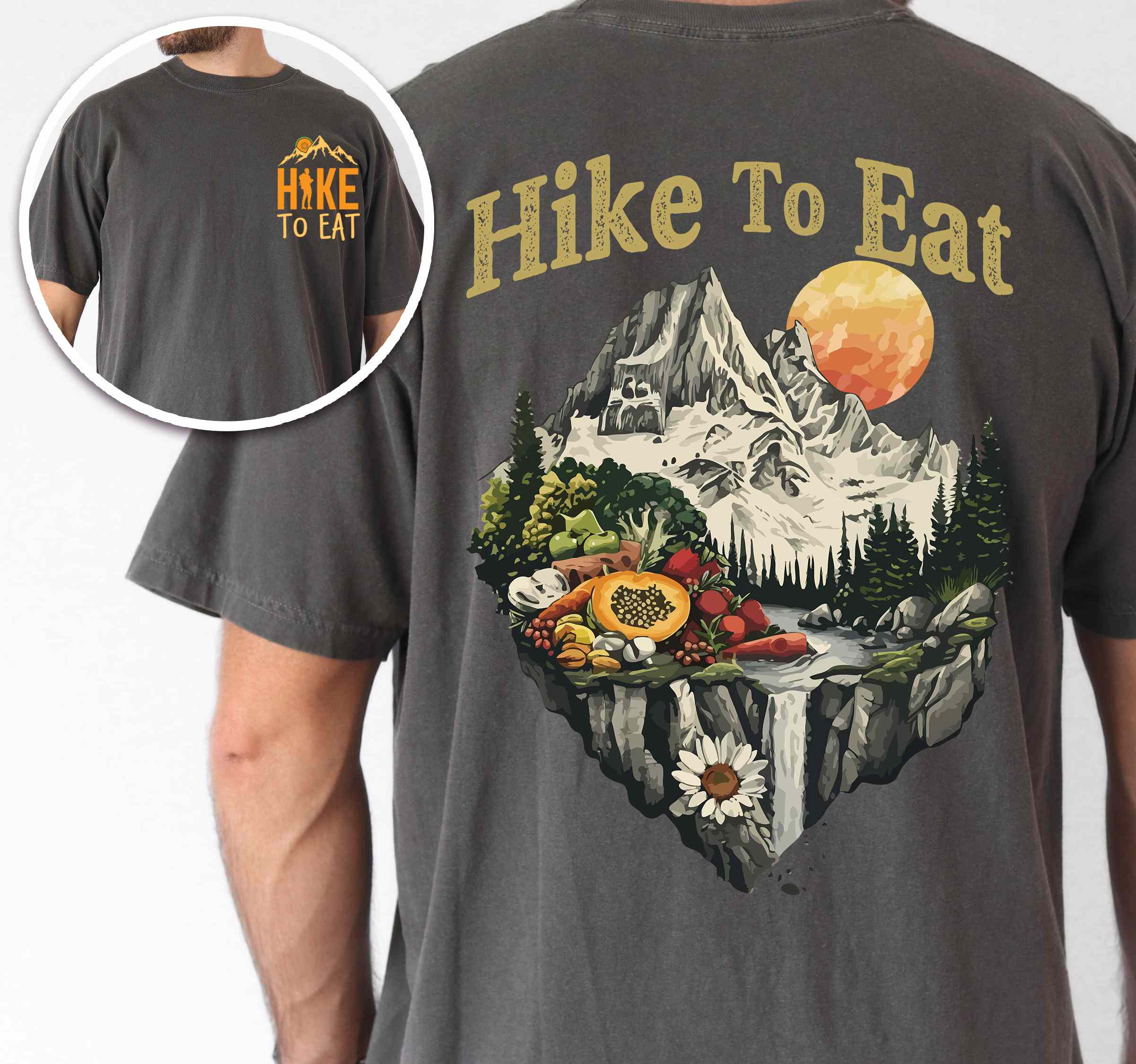 Man wearing pepper colored vintage tee with front and back design "Hike to Eat" text in cream lettering, mountains, birds, illustrated fruits, and backpacker for fruit lovers.