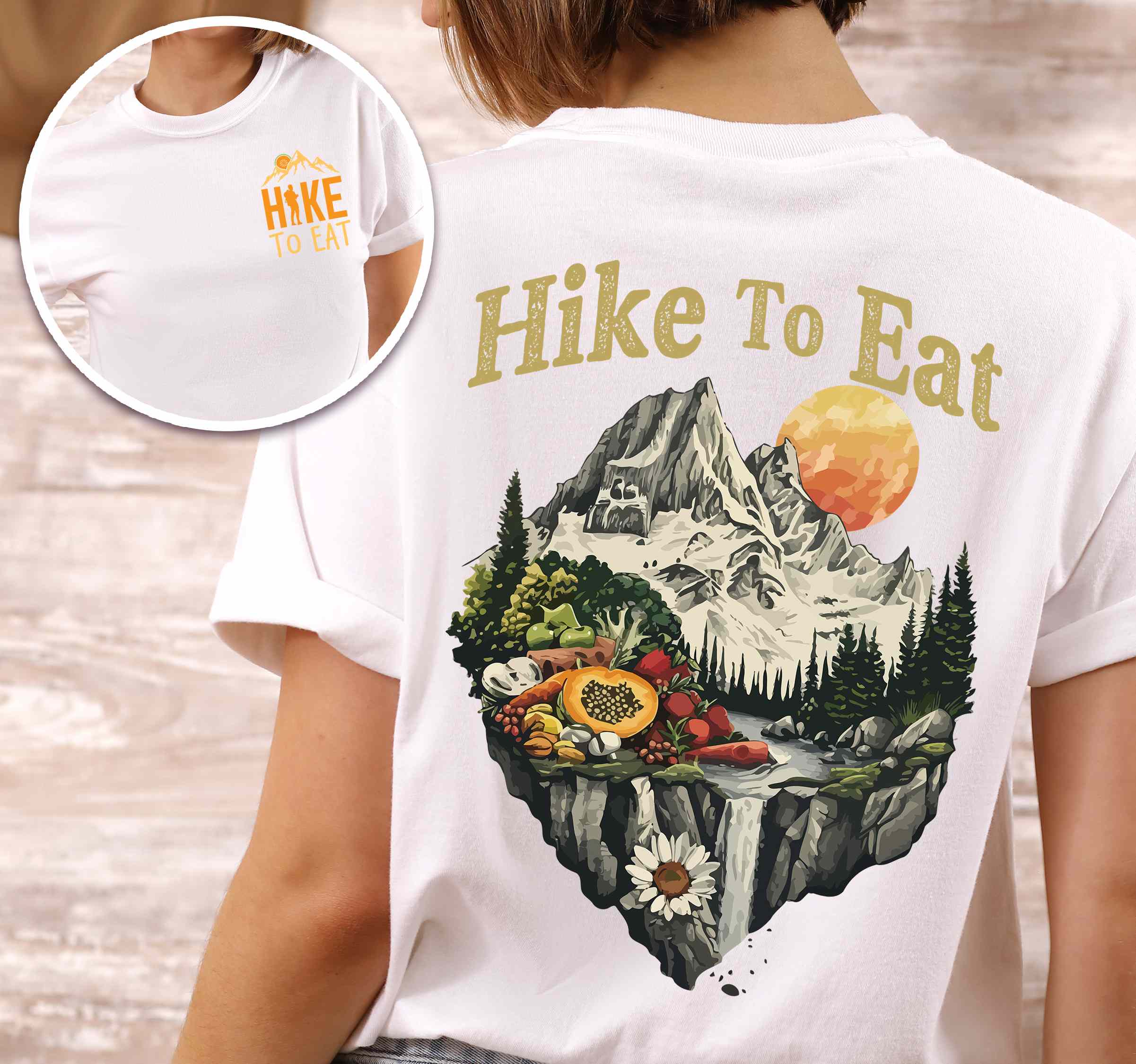 Woman wearing white colored vintage tee with front and back design "Hike to Eat" text in cream lettering, mountains, birds, illustrated fruits, and backpacker for fruit lovers.