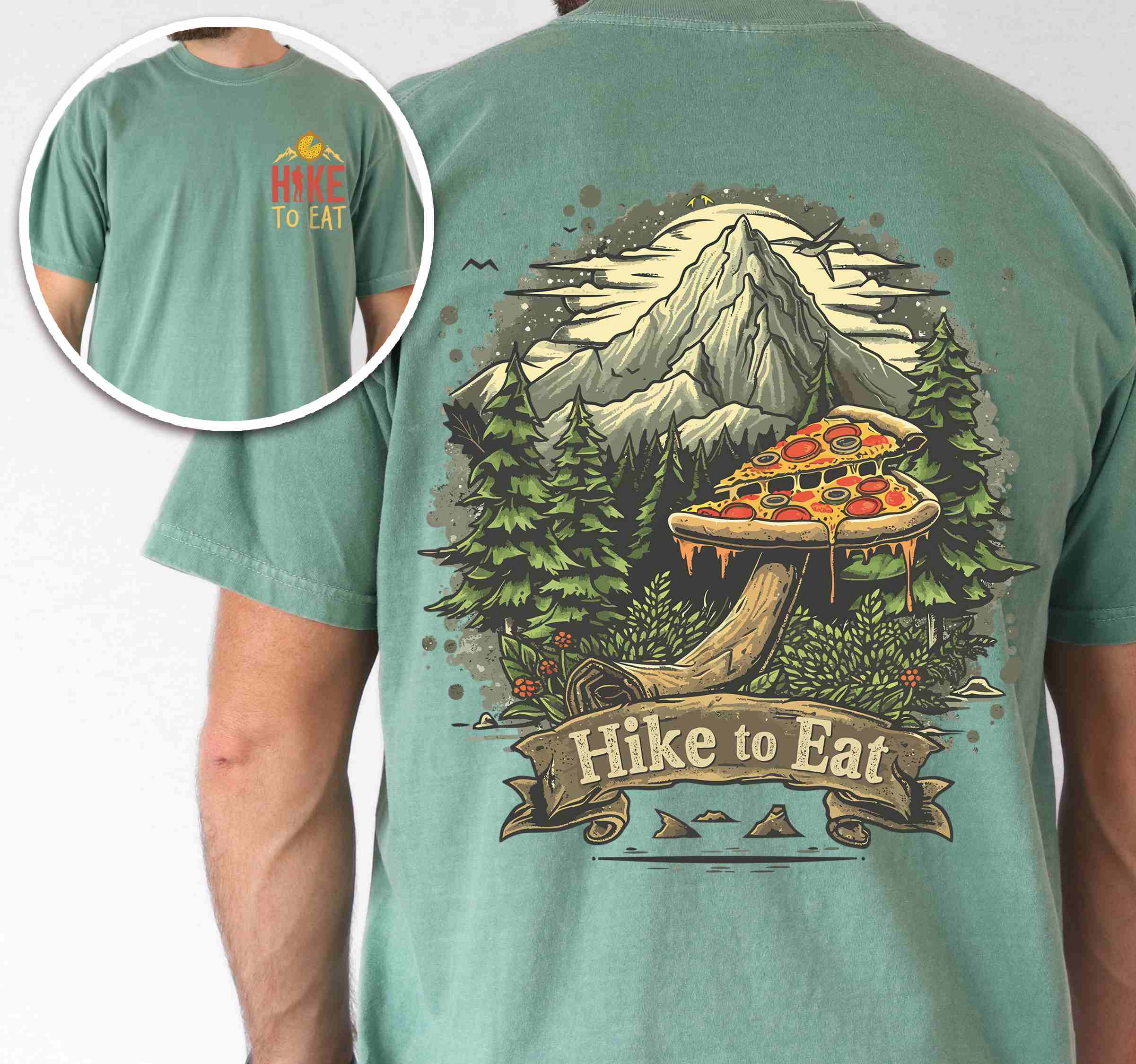 Man wearing light green colored vintage tee with front and back design "Hike to Eat" text in cream lettering, mountains, birds, illustrated pizza slice mushroom top, and backpacker for pizza lovers.