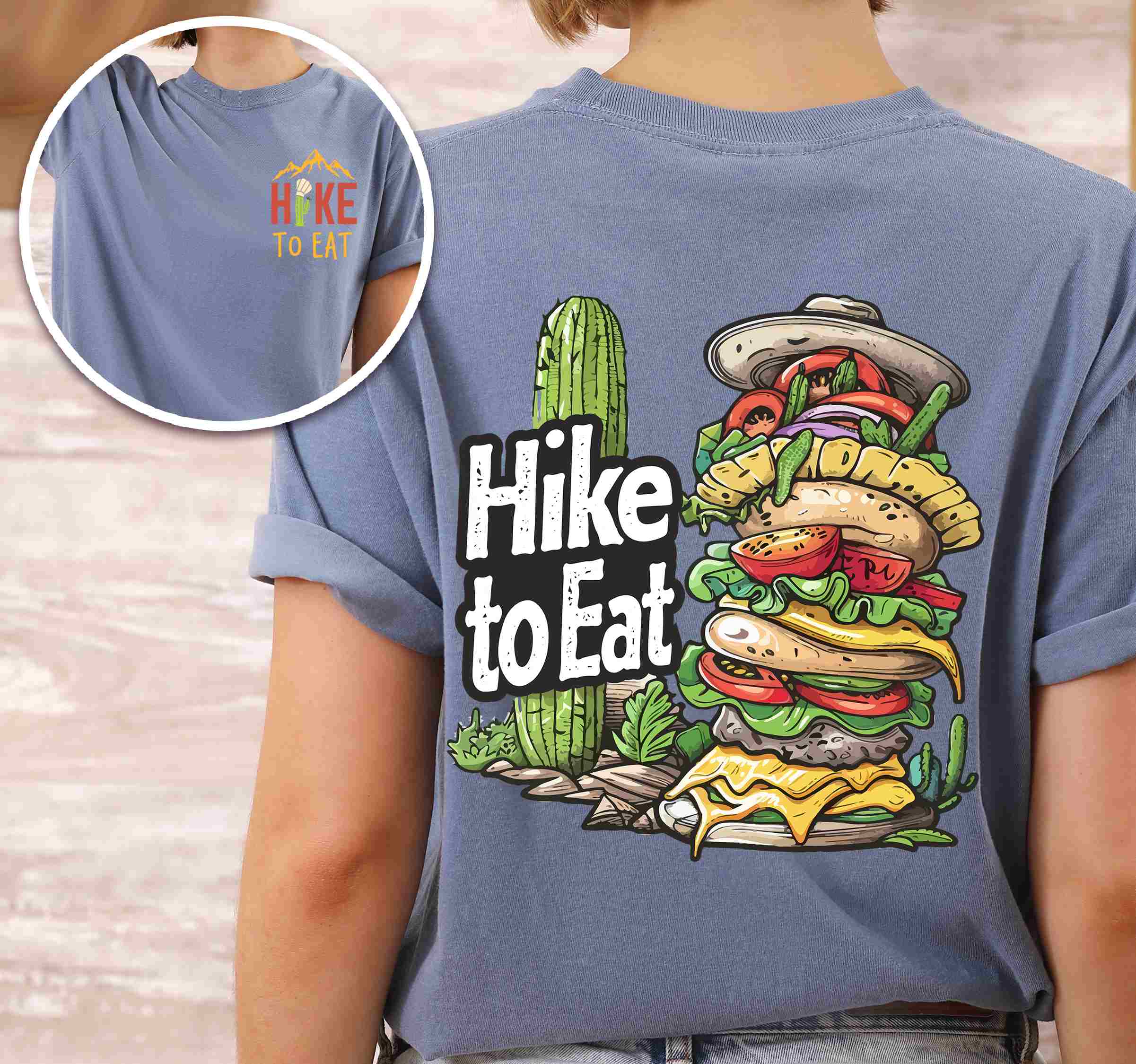 Woman wearing blue jean "Hike to Eat" text in bold lettering front and back design, mountains, birds, illustrated stack of cheeseburger, and backpacker for burger lovers.