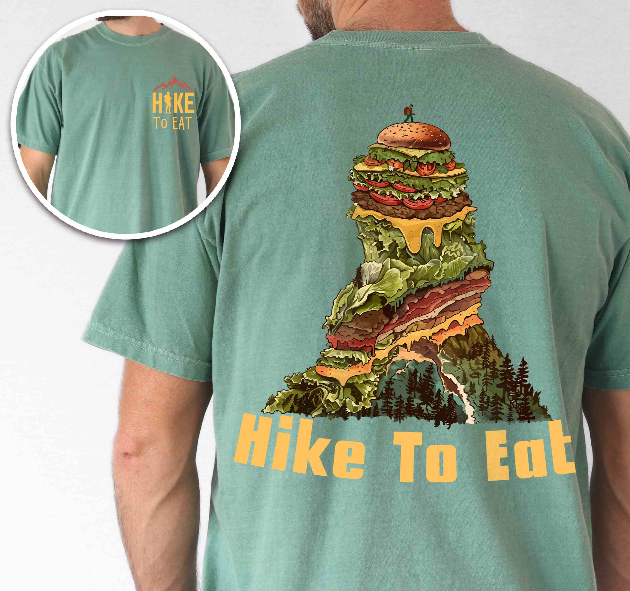 Man wearing light green "Hike to Eat" text in bold lettering front and back design, mountains, birds, illustrated stack of cheeseburger, and backpacker for burger lovers.