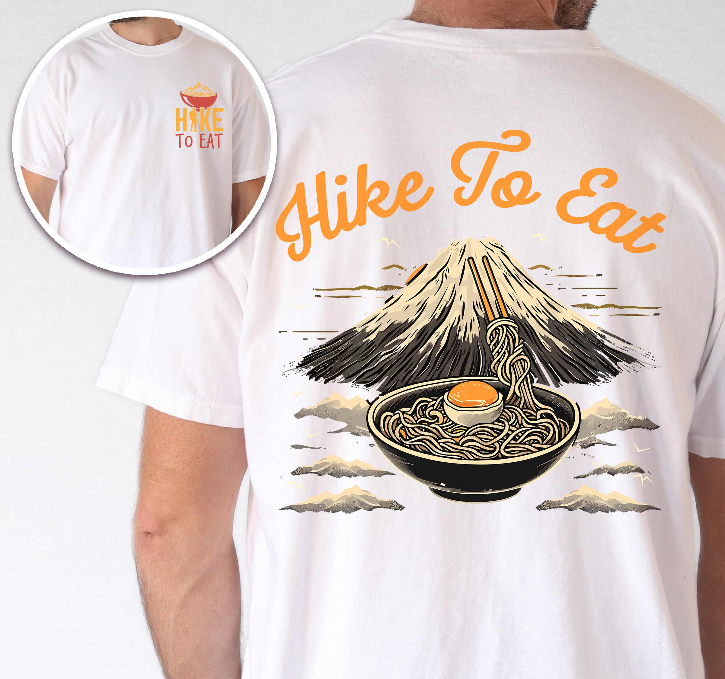 White Hike to Eat t-shirt front and back view showing small orange chest logo with ramen bowl and large back design featuring black steaming ramen bowl with swirling noodles and soft-boiled egg in front of sketched Mount Fuji landscape with clouds.