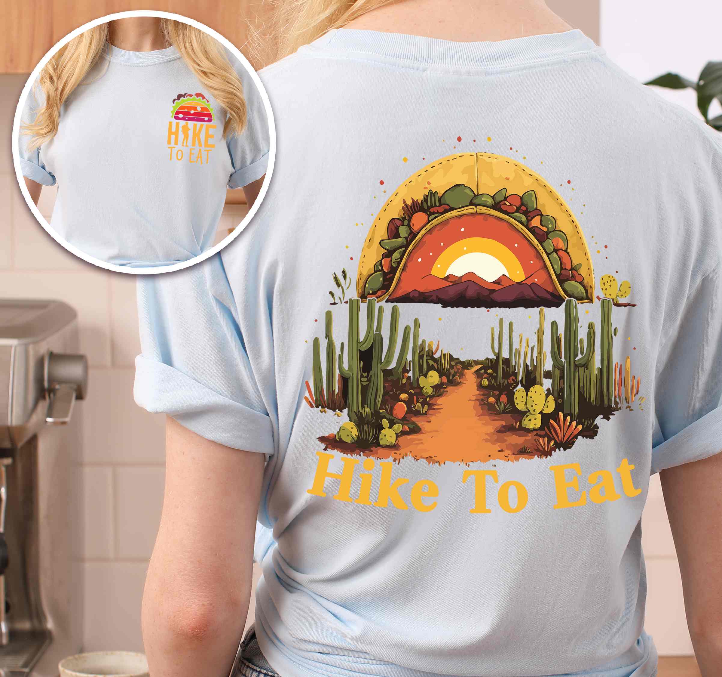Woman wearing chambray "Hike to Eat" text in bold lettering back design, mountains, birds, illustrated sunset taco, and backpacker for taco enthusiasts.