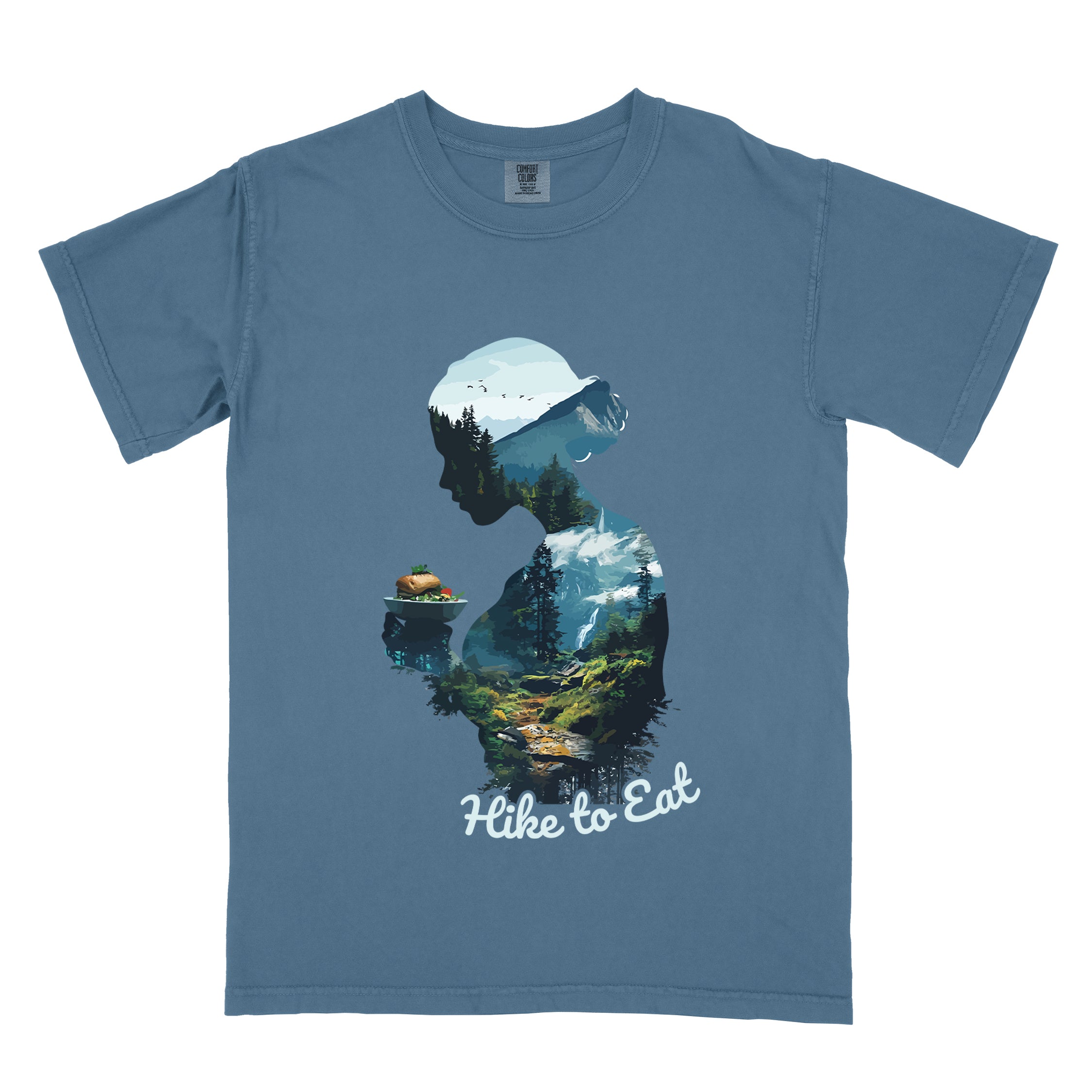Wilderness Within Hike to Eat t-shirt featuring double exposure design of hiker silhouette holding a burger merged with mountain forest landscape on blue jean (blue) Comfort Colors shirt