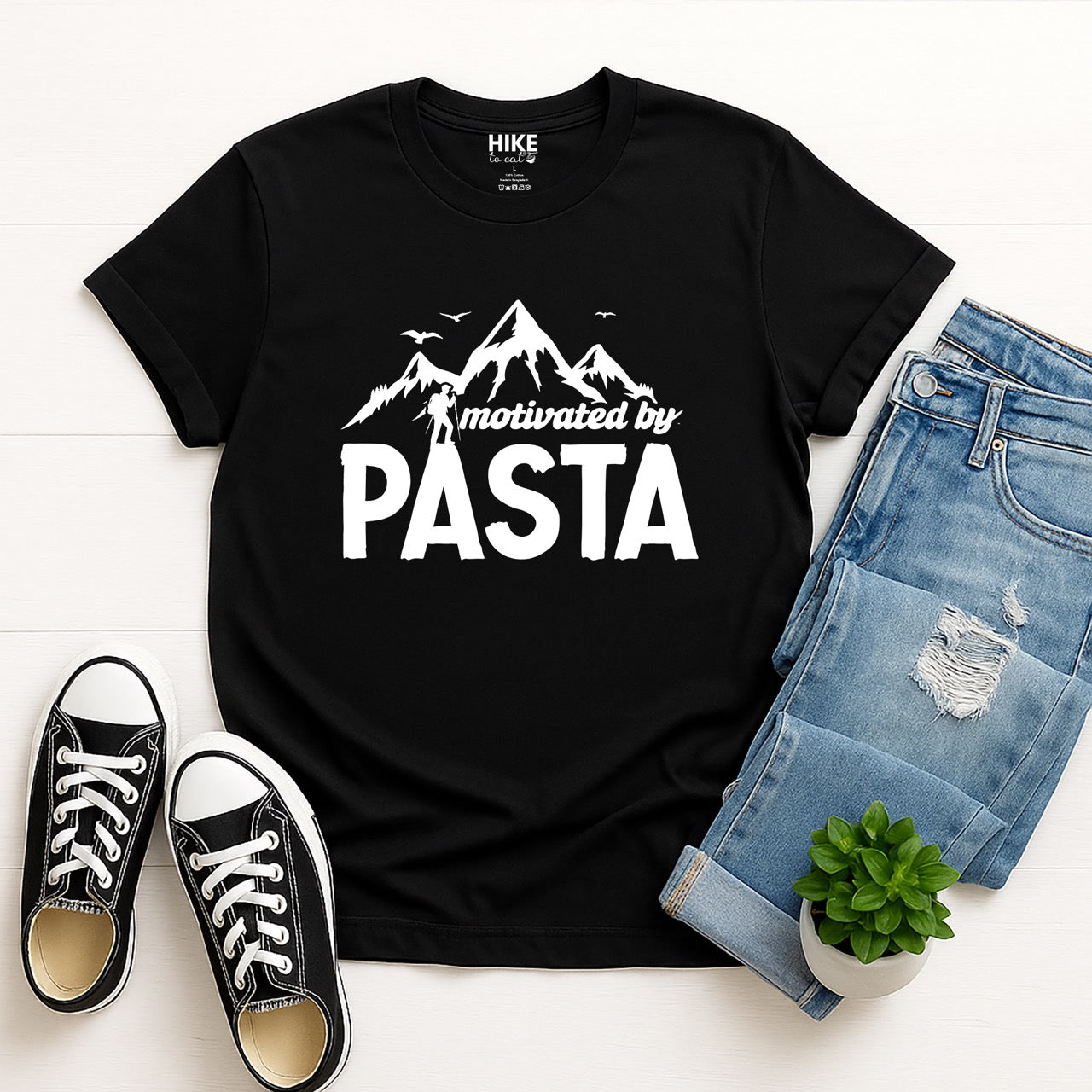 motivated by Pasta statement tee with mountains, birds, and hiker silhouette for pasta enthusiasts and hikers with. jeans and shoes
