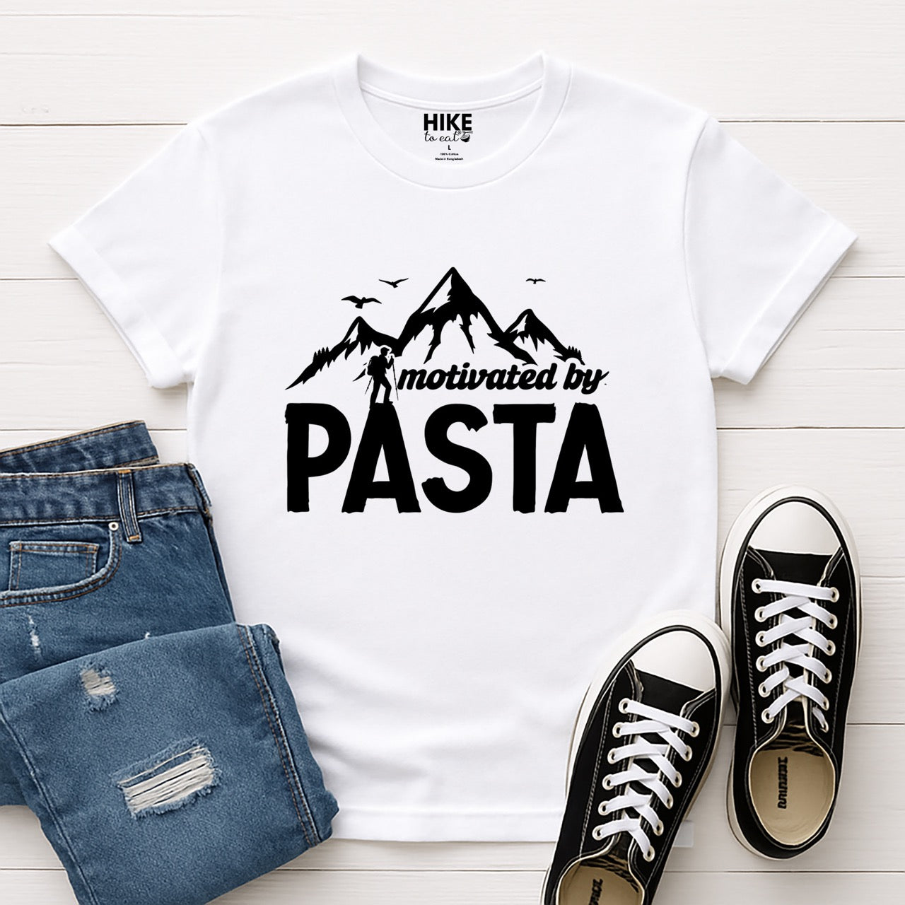 white motivated by Pasta statement tee with mountains, birds, and hiker silhouette for pasta enthusiasts and hikers with jeans and shoes