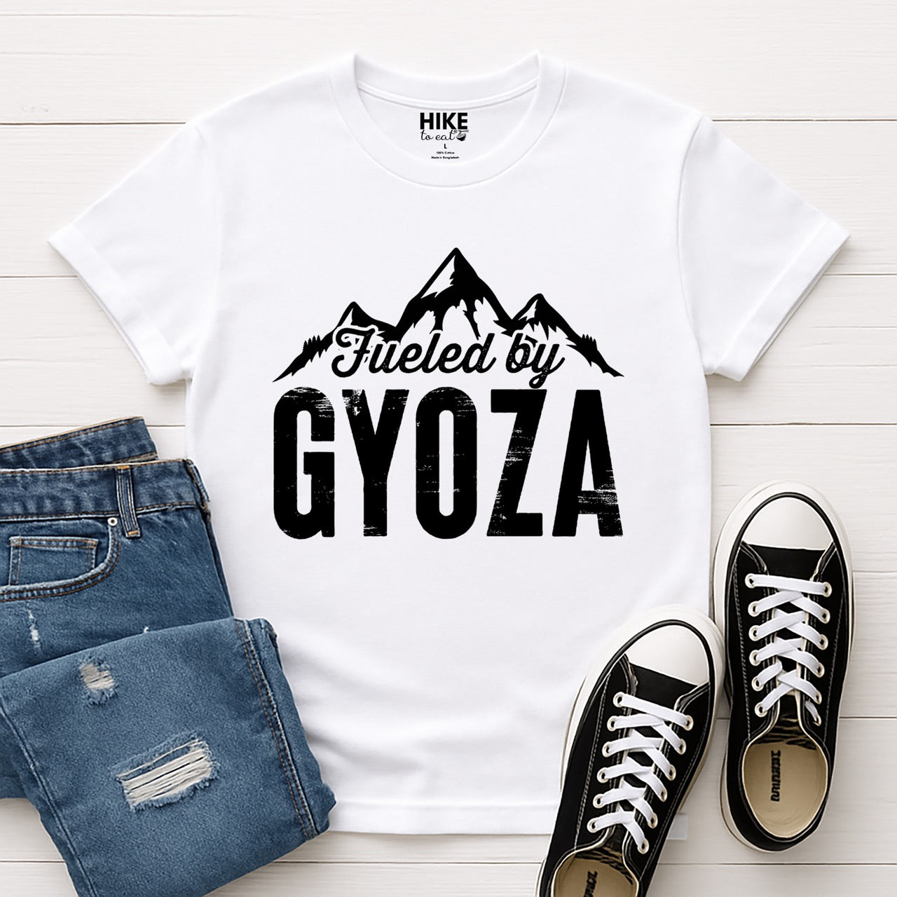 white Fueled by Gyoza statement tee with distressed bold typography and mountain peaks for dumpling enthusiasts and hikers