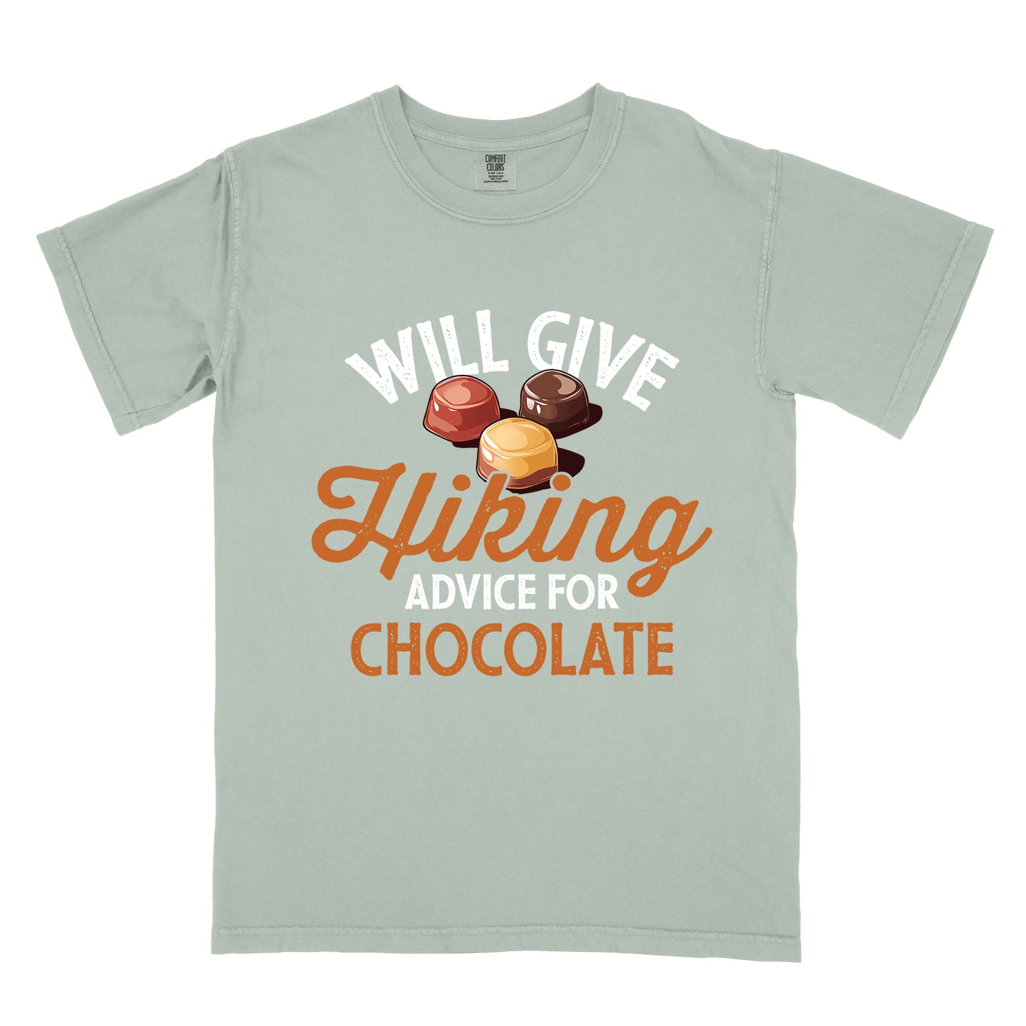Bay (Light Gray) t-shirt with text reading "WILL GIVE Hiking ADVICE FOR CHOCOLATE". The words "WILL GIVE" appear in white distressed text at the top, "Hiking" in orange script in the middle, "ADVICE FOR" in white, and "CHOCOLATE" in orange at the bottom. Above the word "Hiking" is an illustration of three chocolate bonbons in different colors (dark, milk, and caramel).