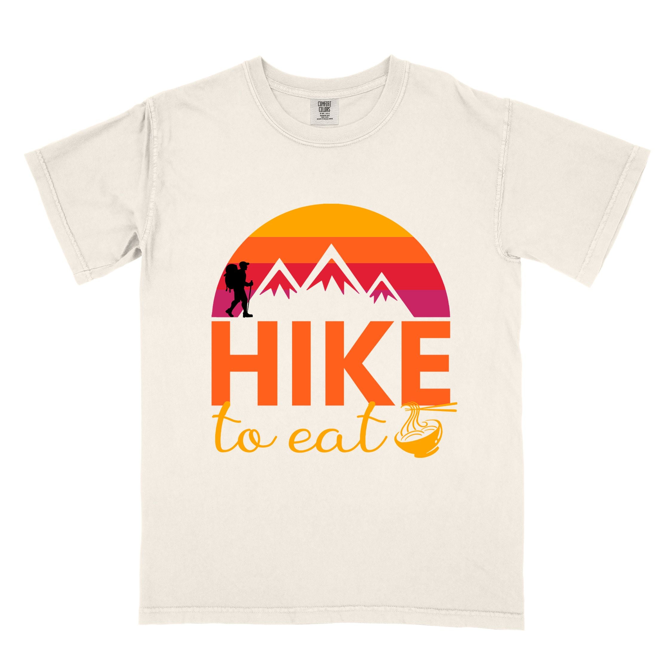 Ivory "Hike to Eat" colored vintage tee with bold typography, mountains, sunrise, and backpacker to savor each step along the trail.