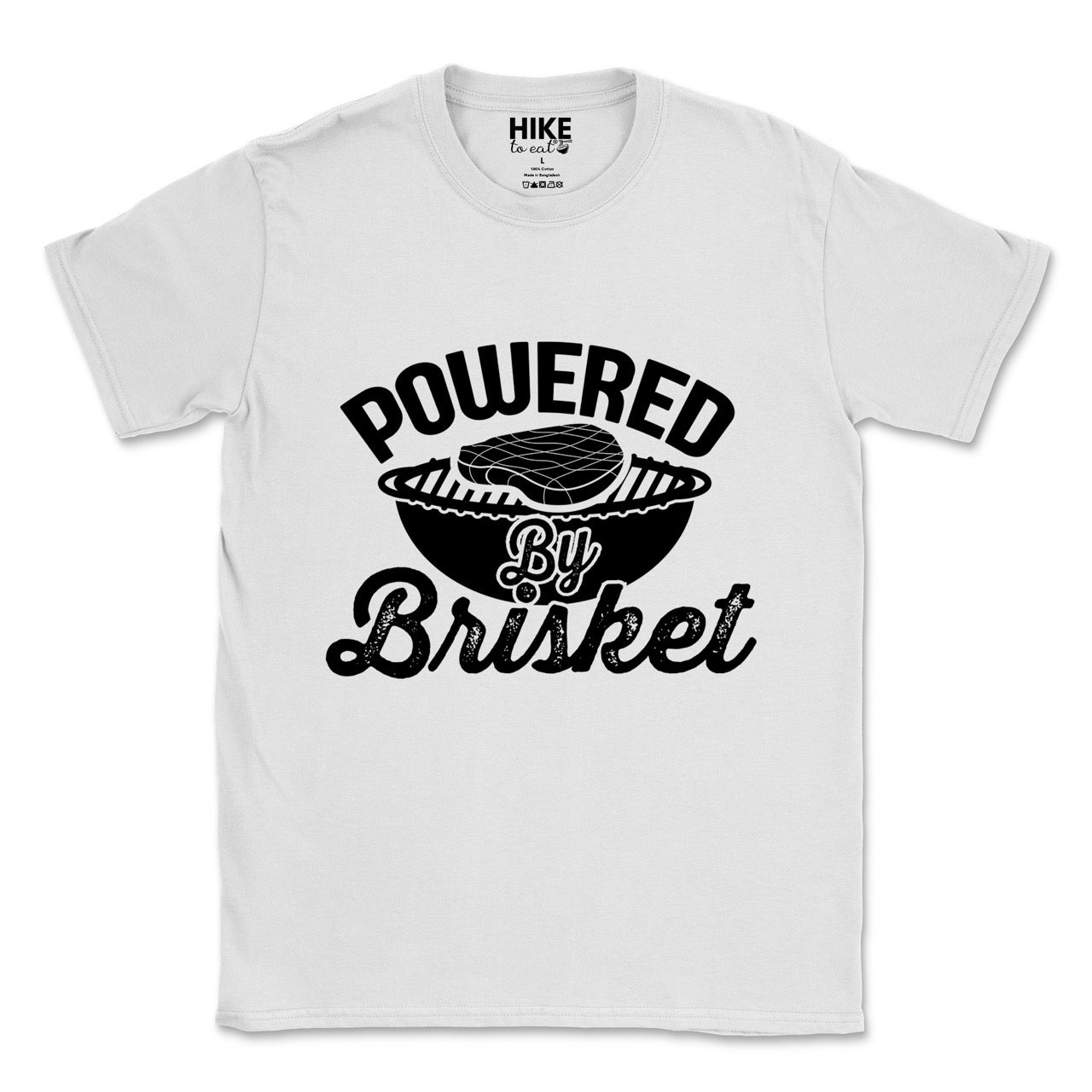 White Powered by Brisket statement tee with bold curved typography, flowing script lettering, and BBQ grill with brisket illustration for barbecue-loving outdoor enthusiasts, hikers and foodies
