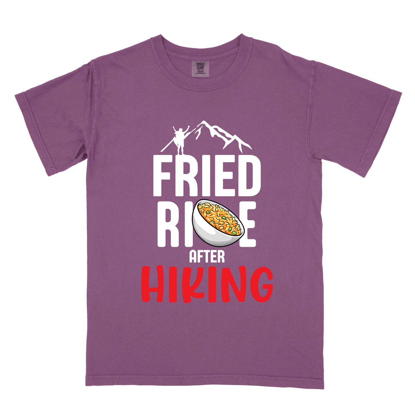 Berry (Dark Violet) t-shirt with text "FRIED RICE AFTER HIKING". The top features white mountain silhouettes with a small hiker figure. "FRIED RICE" appears in large white letters with an illustration of a bowl of fried rice replacing the letter "C" in "RICE", tilted slightly to the right. The word "AFTER" is in small white text, and "HIKING" appears at the bottom in bold red letters.