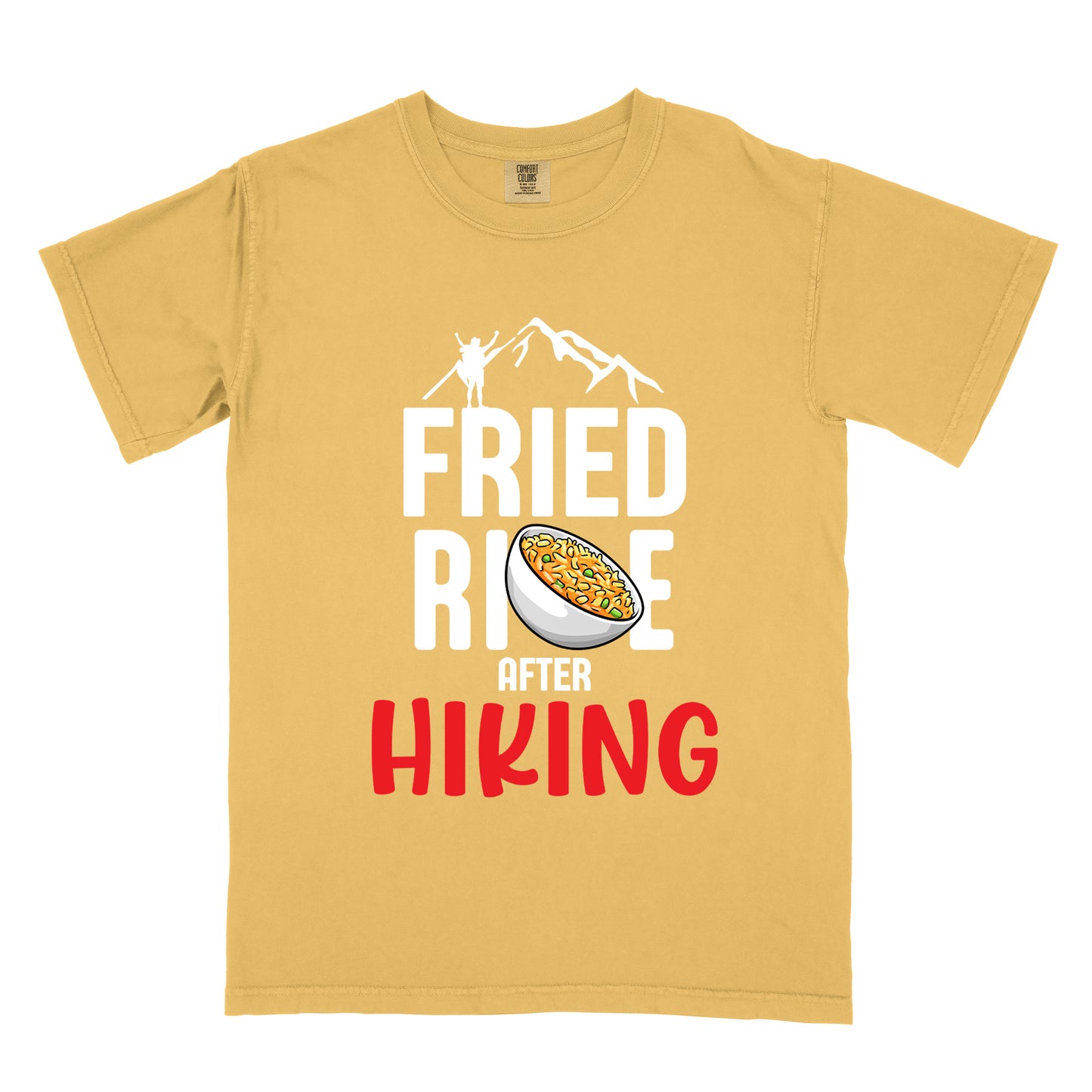 Mustard (Yellow) t-shirt with text "FRIED RICE AFTER HIKING". The top features white mountain silhouettes with a small hiker figure. "FRIED RICE" appears in large white letters with an illustration of a bowl of fried rice replacing the letter "C" in "RICE", tilted slightly to the right. The word "AFTER" is in small white text, and "HIKING" appears at the bottom in bold red letters.